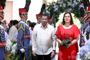 President Rodrigo Roa Duterte walks down the aisle with daughter Davao City Mayor Sara Duterte-Carpio as he attends as one of the principal sponsors during the wedding of Makkaria and First Lieutenant James Estoesta at the St. Ignatius Chapel in Fort Gen. Gregorio H. del Pilar, Baguio City on December 8, 2019. RICHARD MADELO/PRESIDENTIAL PHOTO