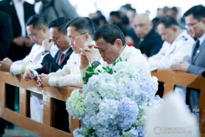 President Rodrigo Roa Duterte kneels in prayer during the wedding of Makkaria and First Lieutenant James Estoesta at the St. Ignatius Chapel in Fort Gen. Gregorio H. del Pilar, Baguio City on December 8, 2019. VALERIE ESCALERA/PRESIDENTIAL PHOTO