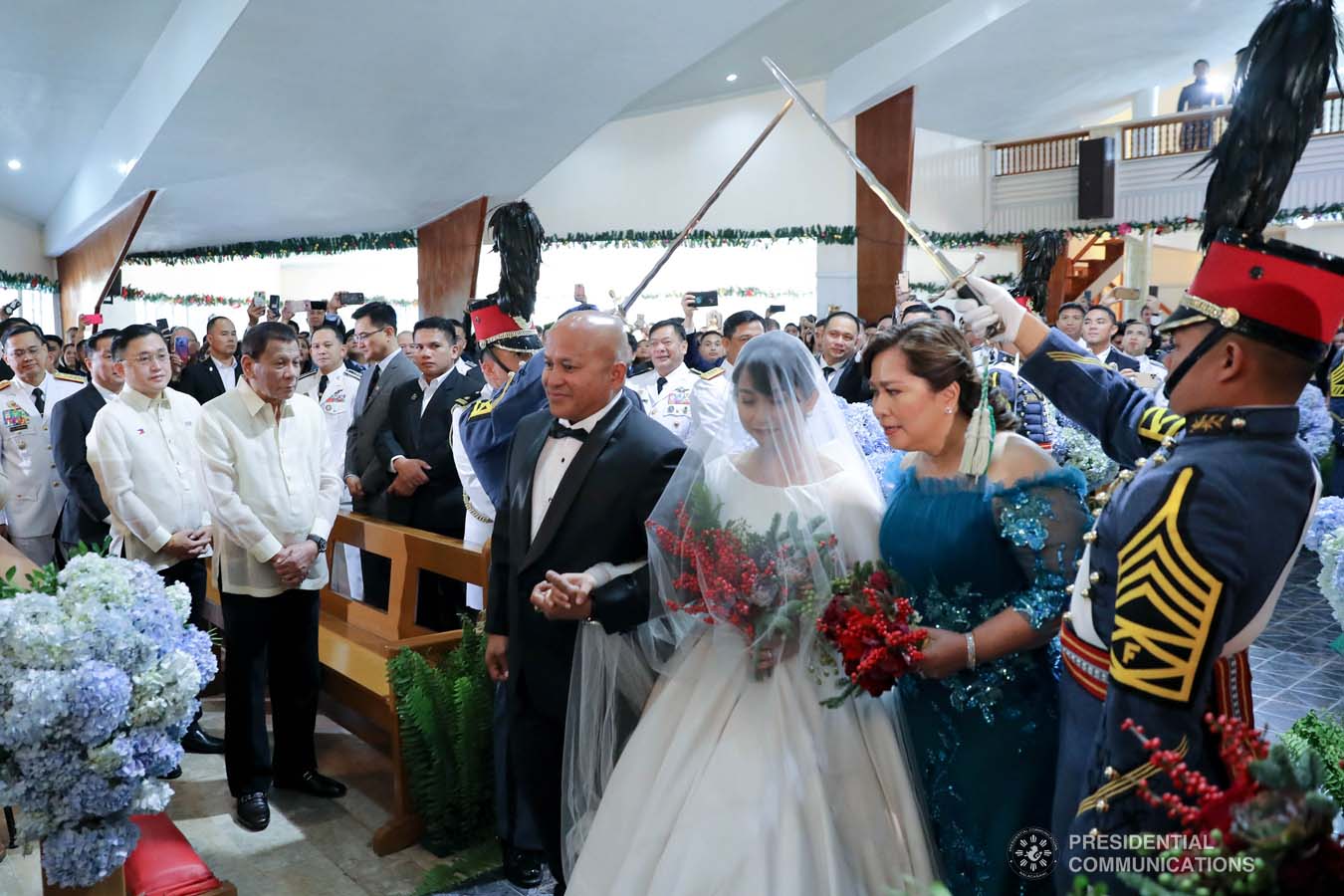 President Rodrigo Roa Duterte witnesses the wedding of Makkaria and First Lieutenant James Estoesta at the St. Ignatius Chapel in Fort Gen. Gregorio H. del Pilar, Baguio City on December 8, 2019. VALERIE ESCALERA/PRESIDENTIAL PHOTO