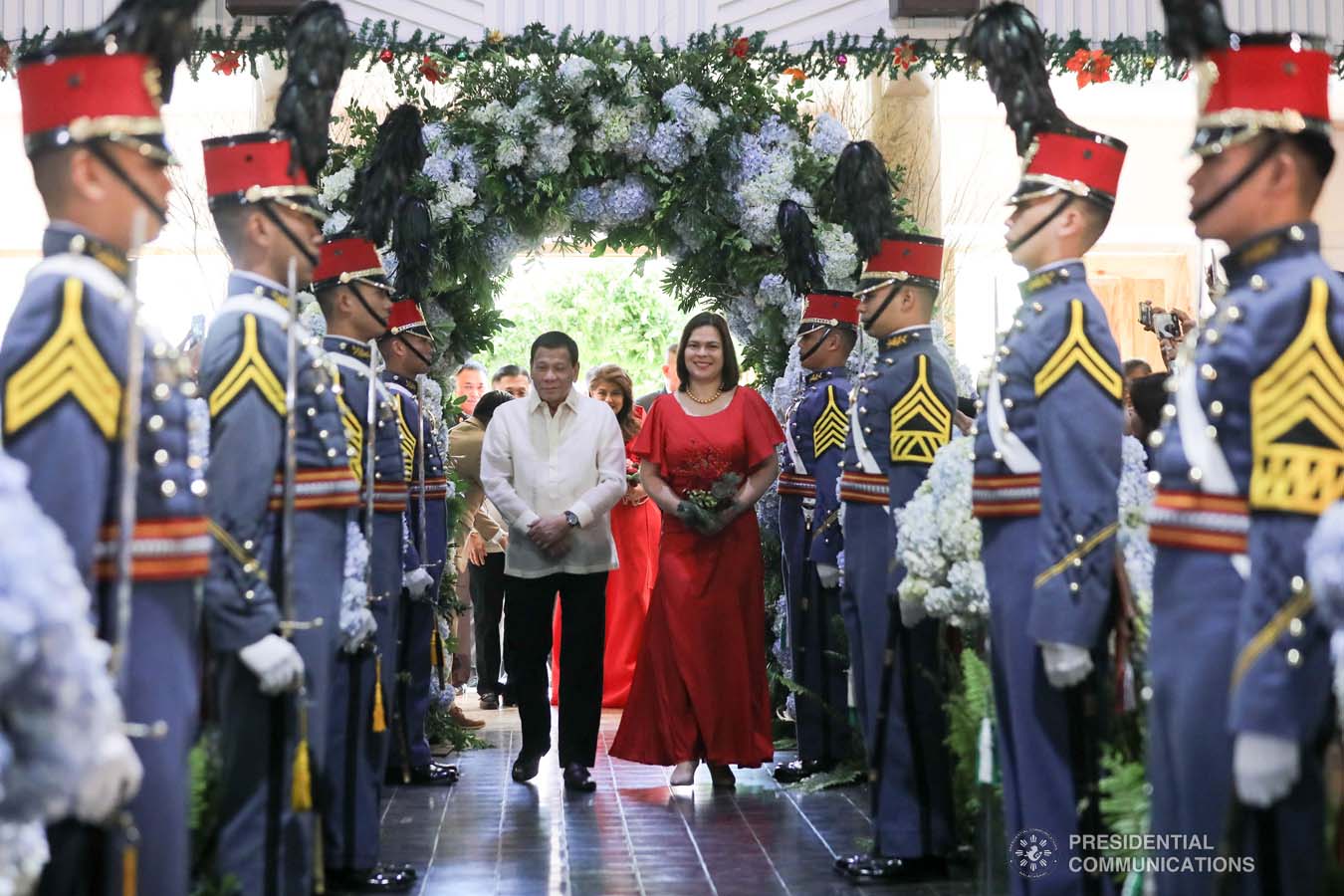 President Rodrigo Roa Duterte walks down the aisle with daughter Davao City Mayor Sara Duterte-Carpio as he attends as one of the principal sponsors during the wedding of Makkaria and First Lieutenant James Estoesta at the St. Ignatius Chapel in Fort Gen. Gregorio H. del Pilar, Baguio City on December 8, 2019. VALERIE ESCALERA/PRESIDENTIAL PHOTO