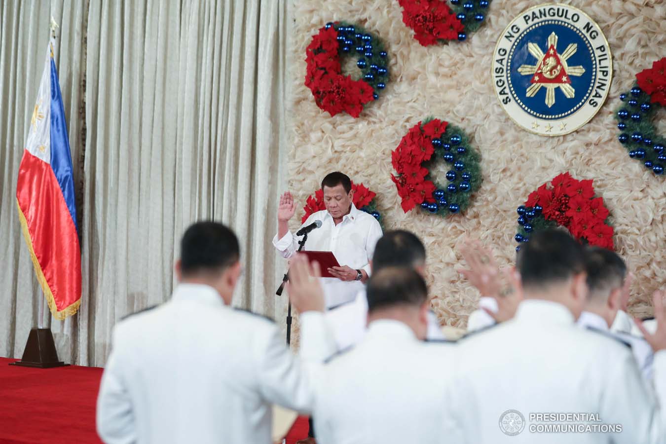 President Rodrigo Roa Duterte administers the oath of office to the newly promoted uniformed personnel of the Bureau of Fire Protection, Bureau of Jail Management and Penology and Philippine Coast Guard at the Malacañan Palace on December 10, 2019. ALFRED FRIAS/PRESIDENTIAL PHOTO