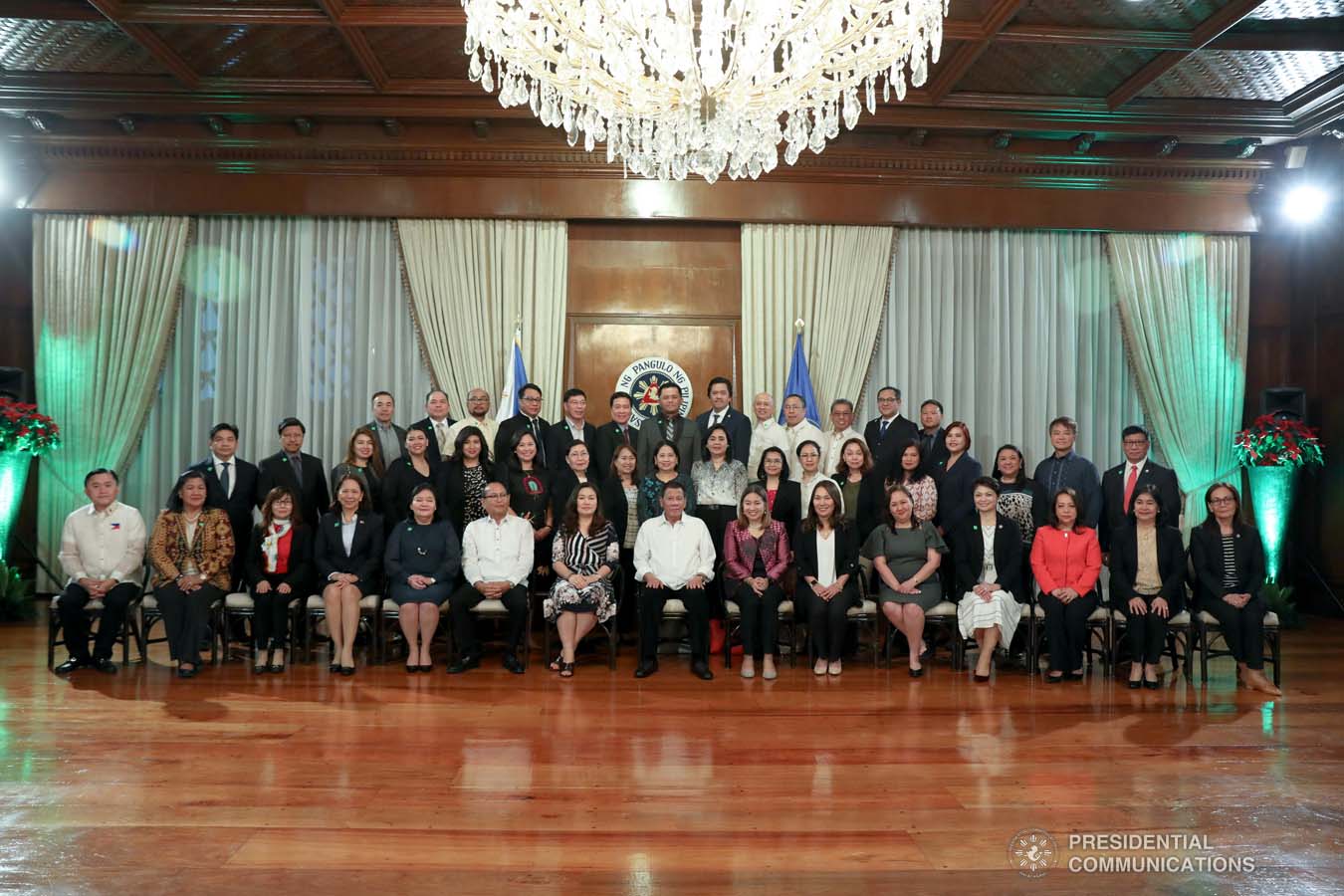 President Rodrigo Roa Duterte and his partner Cielito Avanceña pose for posterity with the Labor Attachés from the Department of Labor and Employment during their meeting at the Malacañan Palace on December 9, 2019. ROBINSON NIÑAL JR./PRESIDENTIAL PHOTO