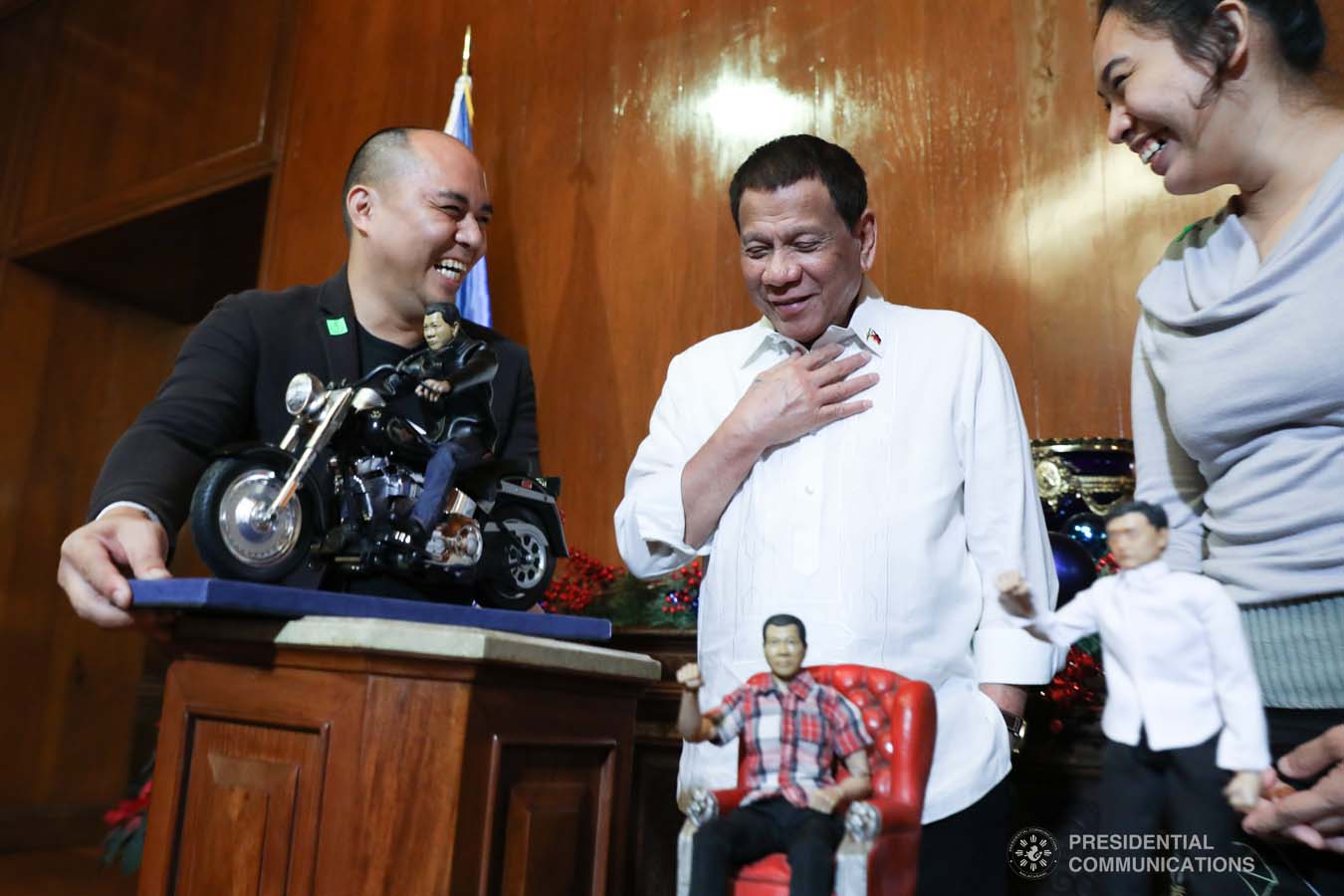 President Rodrigo Roa Duterte admires the miniature dolls given by toymaker Dennis Mendoza during their meeting at the Malacañan Palace on December 9, 2019. ROBINSON NIÑAL JR./PRESIDENTIAL PHOTO