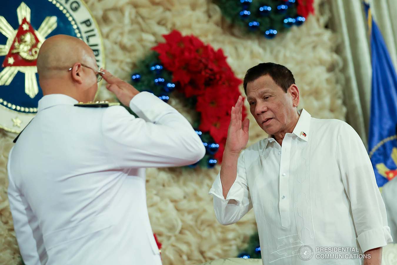President Rodrigo Roa Duterte salutes one of the newly-appointed flag officers of the Armed Forces of the Philippines during the oath-taking ceremony at the Malacañan Palace on December 9, 2019. ROBINSON NIÑAL JR./PRESIDENTIAL PHOTO