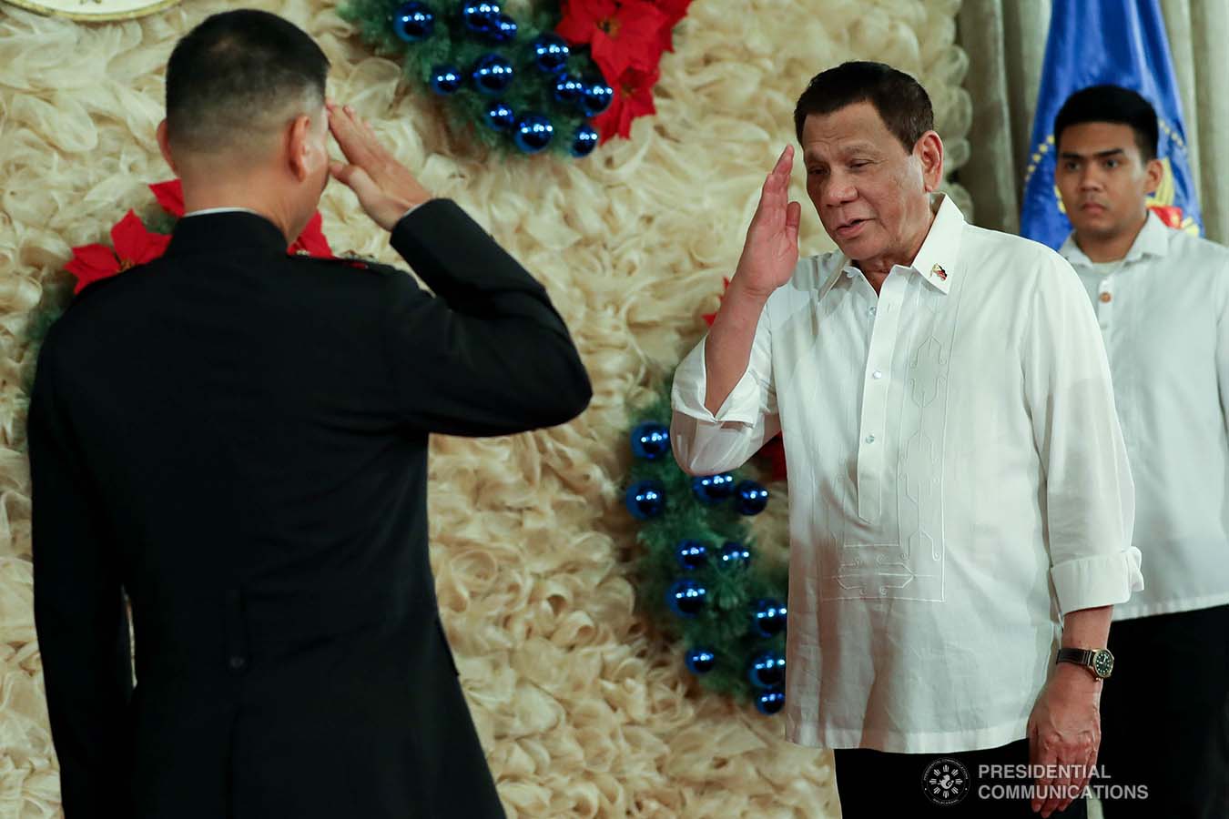 President Rodrigo Roa Duterte salutes one of the newly-appointed flag officers of the Armed Forces of the Philippines during the oath-taking ceremony at the Malacañan Palace on December 9, 2019. ROBINSON NIÑAL JR./PRESIDENTIAL PHOTO