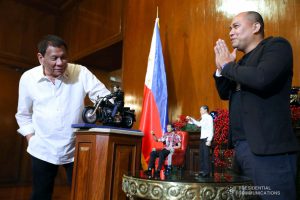 President Rodrigo Roa Duterte admires the miniature dolls given by toymaker Dennis Mendoza during their meeting at the Malacañan Palace on December 9, 2019. ROBINSON NIÑAL JR./PRESIDENTIAL PHOTO