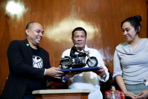 President Rodrigo Roa Duterte receives miniature dolls from toymaker Dennis Mendoza during their meeting at the Malacañan Palace on December 9, 2019. ROBINSON NIÑAL JR./PRESIDENTIAL PHOTO
