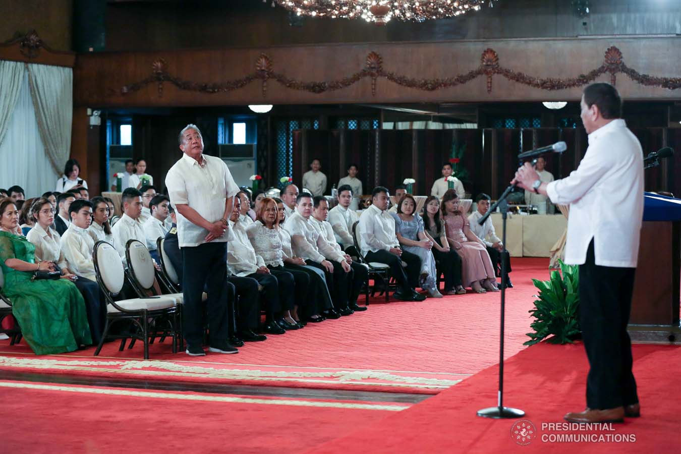 President Rodrigo Roa Duterte talks to Transportation Secretary Arthur Tugade while delivering his speech during the oath-taking ceremony of the newly promoted uniformed personnel of the Bureau of Fire Protection, Bureau of Jail Management and Penology and Philippine Coast Guard at the Malacañan Palace on December 10, 2019. SIMEON CELI JR./PRESIDENTIAL PHOTO