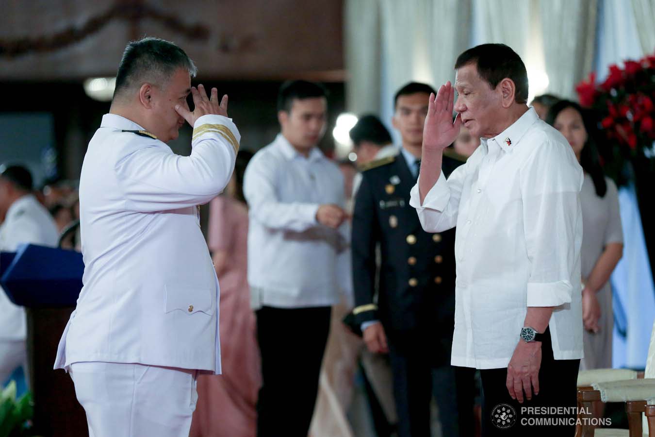 President Rodrigo Roa Duterte salutes one of the newly promoted uniformed personnel of the Philippine Coast Guard during the oath-taking ceremony at the Malacañan Palace on December 10, 2019. SIMEON CELI JR./PRESIDENTIAL PHOTO
