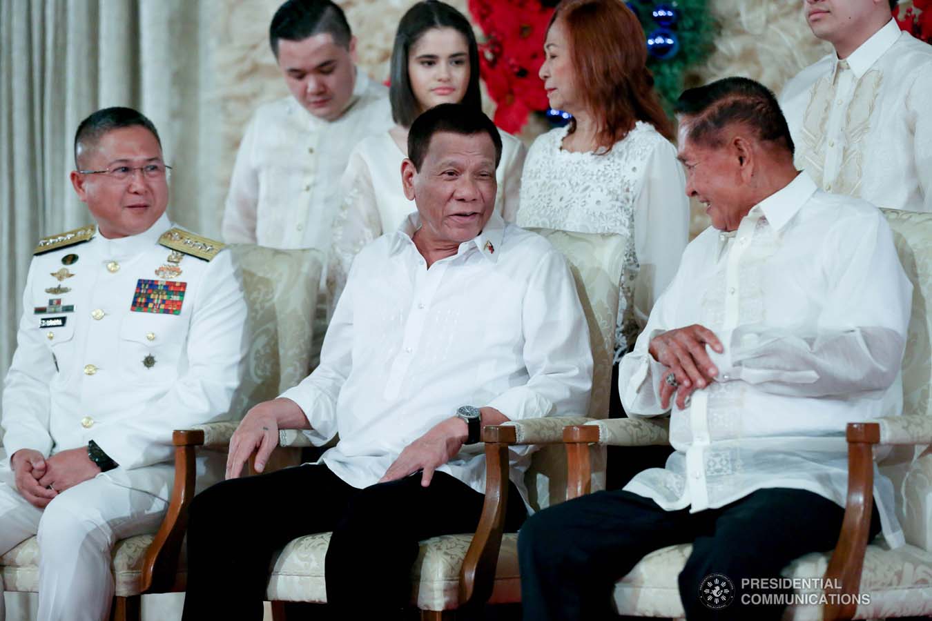 President Rodrigo Roa Duterte shares a light moment with a family member of newly promoted Vice Admiral Joel Garcia during the oath-taking ceremony at the Malacañan Palace on December 10, 2019. SIMEON CELI JR./PRESIDENTIAL PHOTO