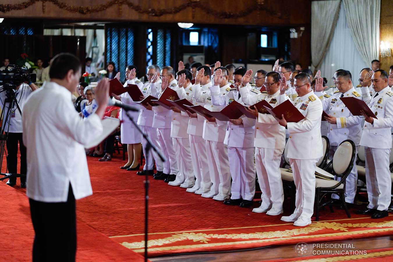 President Rodrigo Roa Duterte administers the oath of office to the newly promoted uniformed personnel of the Bureau of Fire Protection, Bureau of Jail Management and Penology and Philippine Coast Guard at the Malacañan Palace on December 10, 2019. KING RODRIGUEZ/PRESIDENTIAL PHOTO