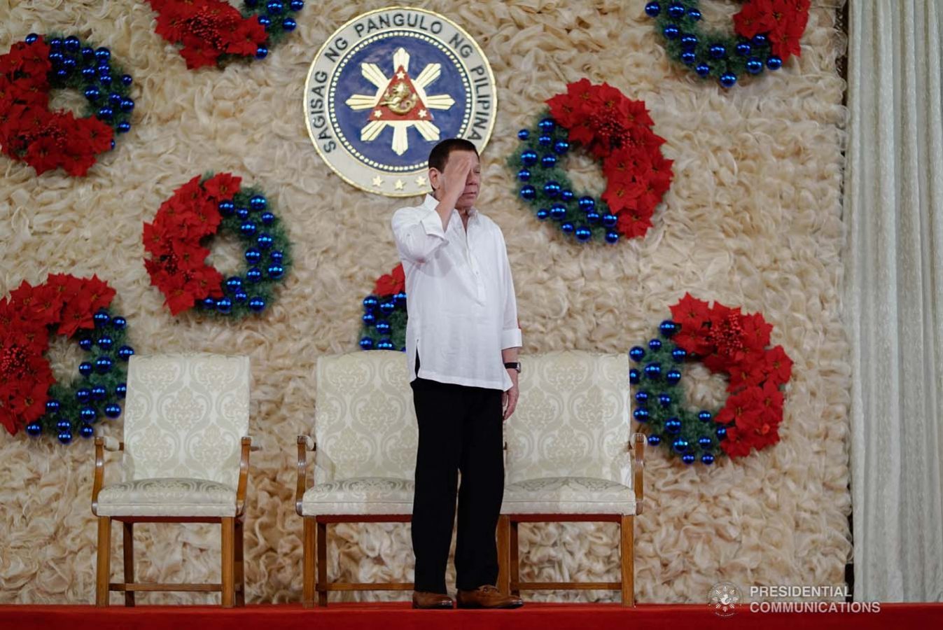 President Rodrigo Roa Duterte salutes the newly promoted uniformed personnel of the Bureau of Fire Protection, Bureau of Jail Management and Penology and Philippine Coast Guard during the oath-taking ceremony at the Malacañan Palace on December 10, 2019. KING RODRIGUEZ/PRESIDENTIAL PHOTO