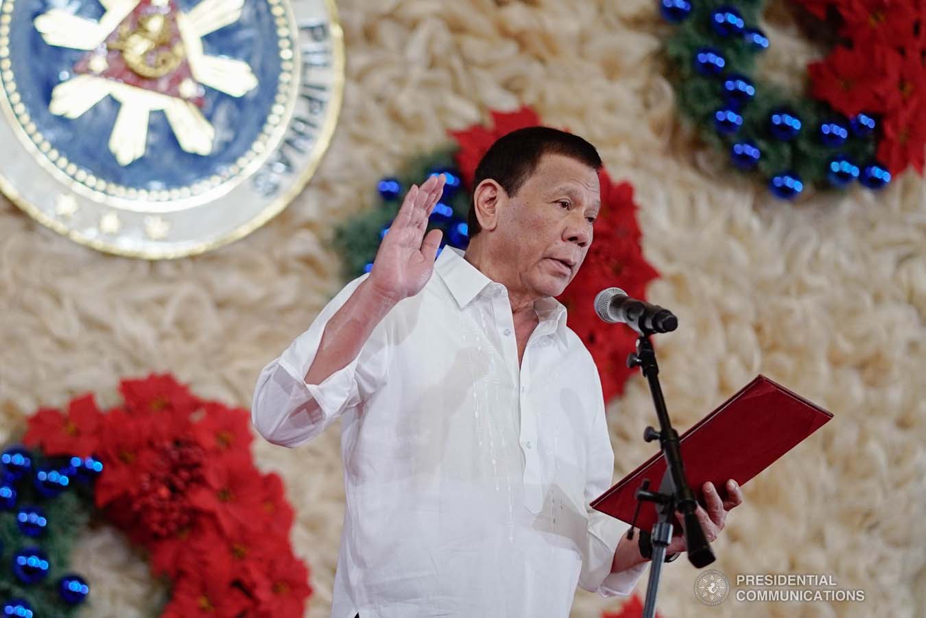 President Rodrigo Roa Duterte administers the oath of office to the newly promoted uniformed personnel of the Bureau of Fire Protection, Bureau of Jail Management and Penology and Philippine Coast Guard at the Malacañan Palace on December 10, 2019. KING RODRIGUEZ/PRESIDENTIAL PHOTO