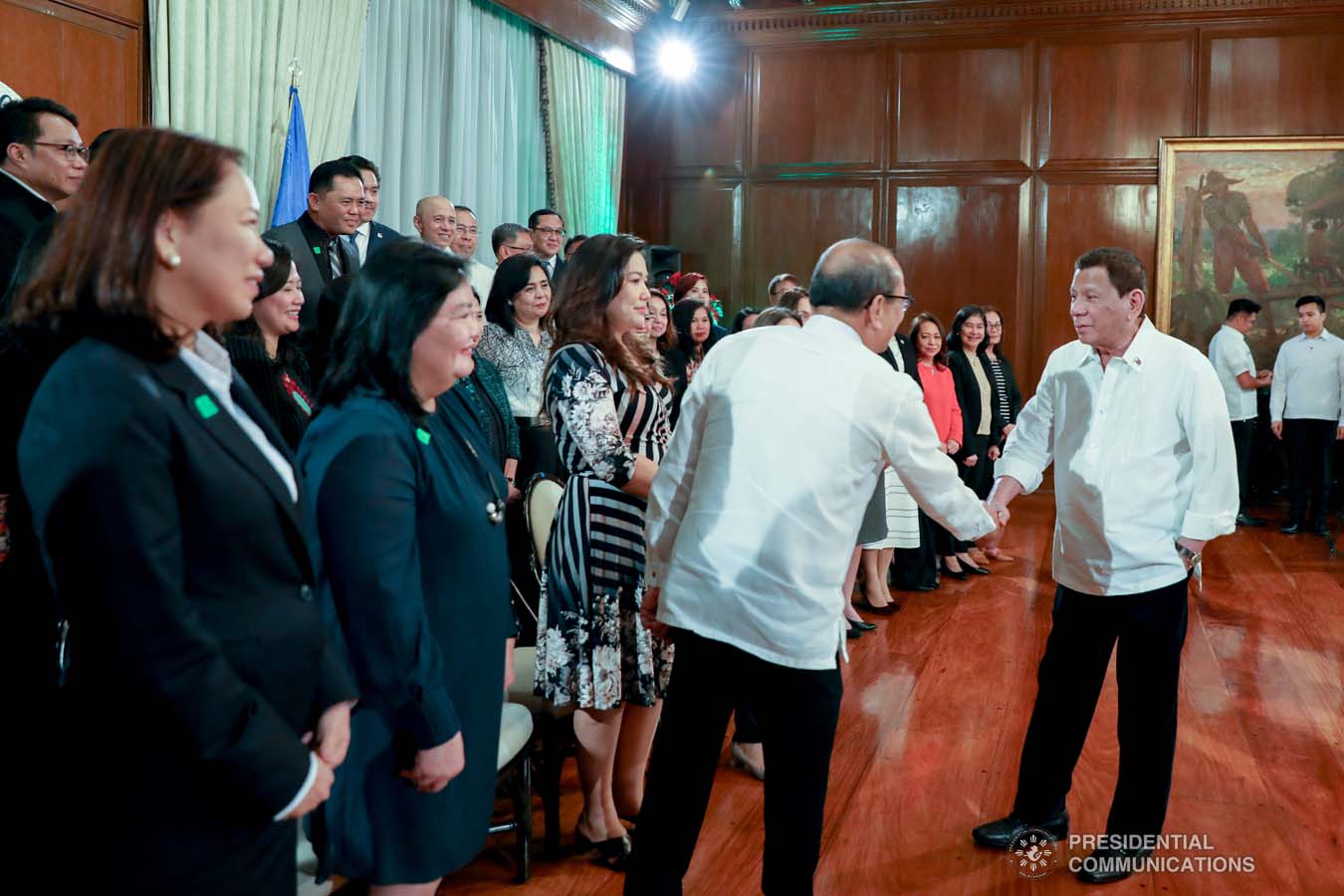 President Rodrigo Roa Duterte greets an official from the Department of Labor and Employment (DOLE) during the meeting with DOLE's Labor Attachés at the Malacañan Palace on December 9, 2019. KARL NORMAN ALONZO/PRESIDENTIAL PHOTO