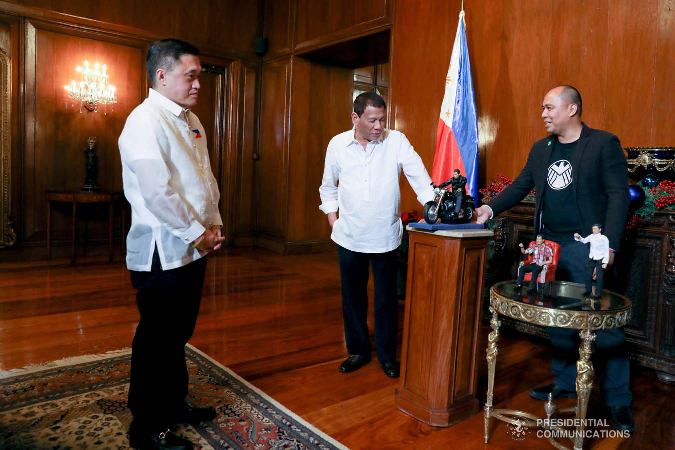 President Rodrigo Roa Duterte receives miniature dolls from toymaker Dennis Mendoza during their meeting at the Malacañan Palace on December 9, 2019. KARL NORMAN ALONZO/PRESIDENTIAL PHOTO