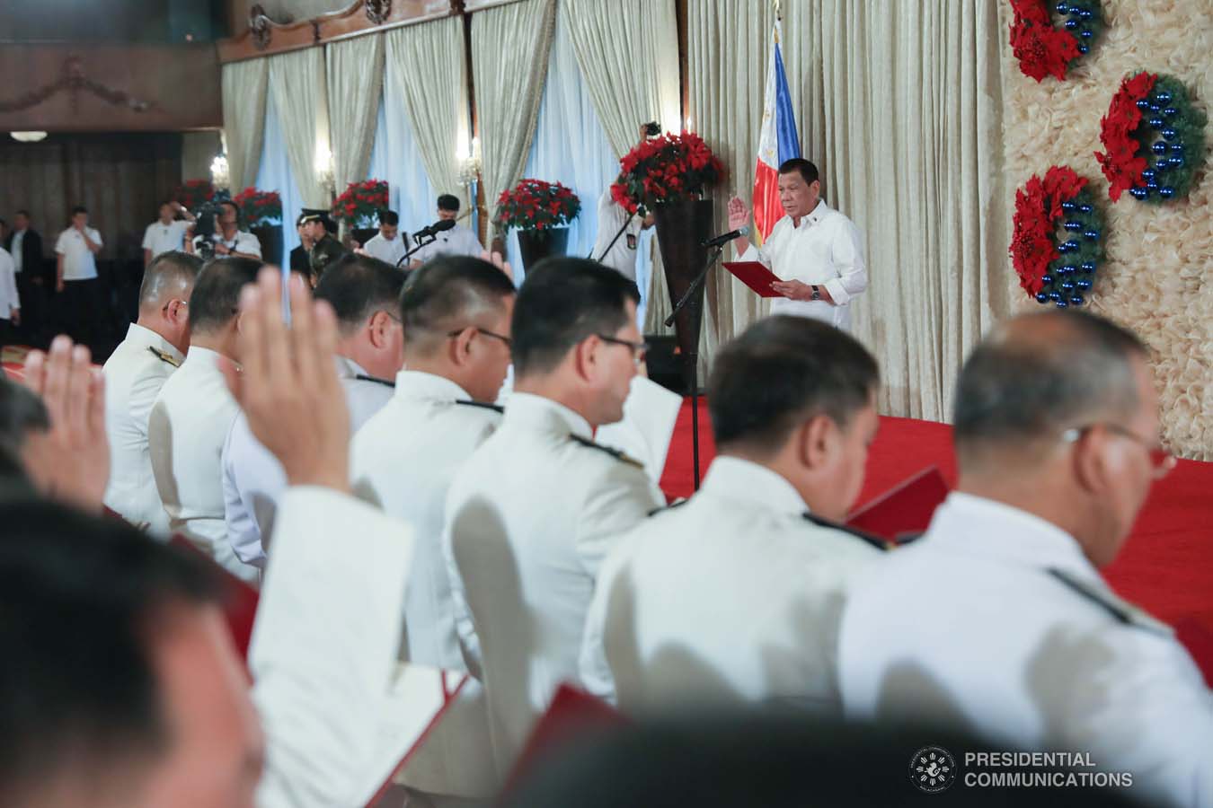 President Rodrigo Roa Duterte administers the oath of office to newly promoted uniformed personnel of the Bureau of Fire Protection, Bureau of Jail Management and Penology and Philippine Coast Guard at the Malacañan Palace on December 10, 2019. RICHARD MADELO/PRESIDENTIAL PHOTO