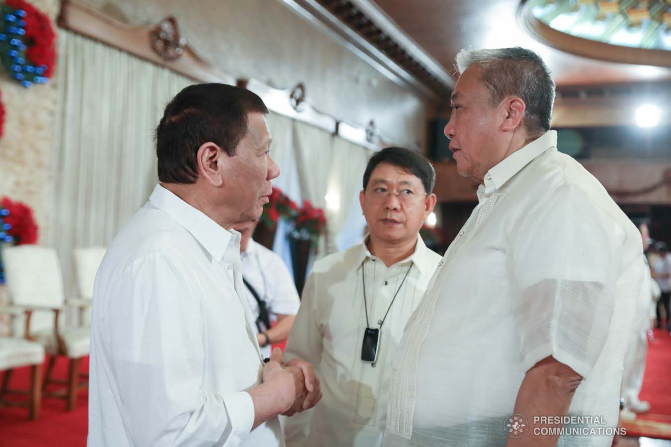 President Rodrigo Roa Duterte discusses matters with Transportation Secretary Arthur Tugade and Interior and Local Government Secretary Eduardo Año during the oath-taking ceremony of newly promoted uniformed personnel of the Bureau of Fire Protection, Bureau of Jail Management and Penology and Philippine Coast Guard at the Malacañan Palace on December 10, 2019. RICHARD MADELO/PRESIDENTIAL PHOTO