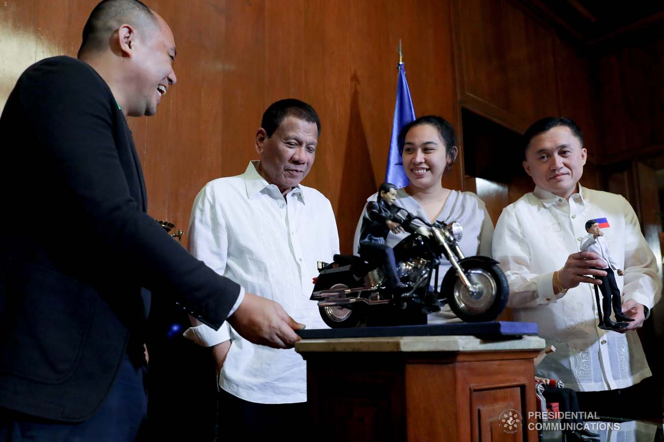 President Rodrigo Roa Duterte receives the miniature dolls given by toymaker Dennis Mendoza during their meeting at the Malacañan Palace on December 9, 2019. REY BANIQUET/PRESIDENTIAL PHOTO