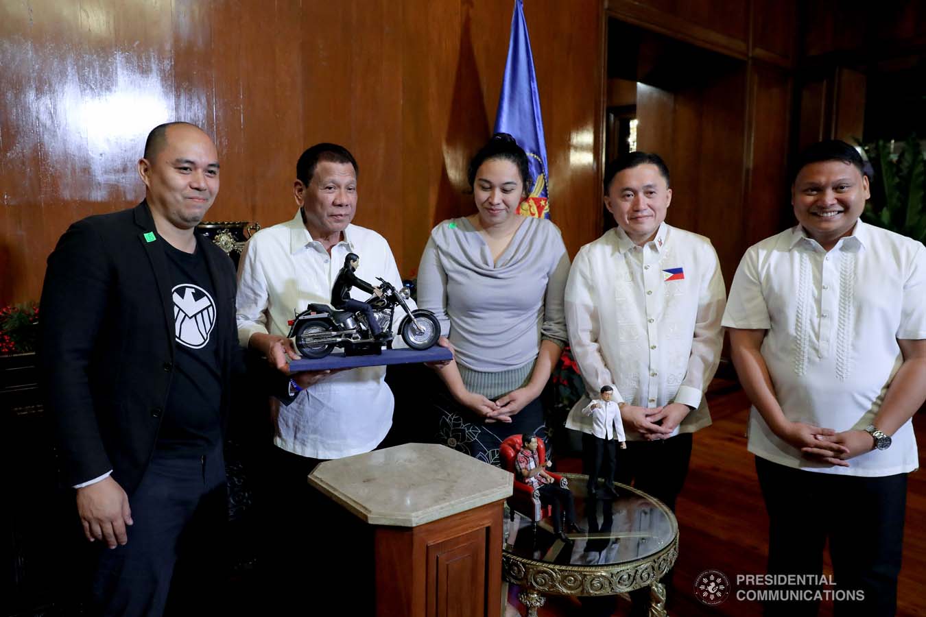 President Rodrigo Roa Duterte receives the miniature dolls from toymaker Dennis Mendoza during their meeting at the Malacañan Palace on December 9, 2019. REY BANIQUET/PRESIDENTIAL PHOTO