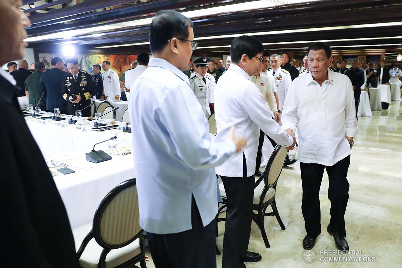 President Rodrigo Roa Duterte greets National Intelligence Coordinating Agency Director General Alex Monteagudo prior to the start of the joint Armed Forces of the Philippines-Philippine National Police (AFP-PNP) Command Conference at the Malacañan Palace on December 9, 2019. REY BANIQUET/PRESIDENTIAL PHOTO