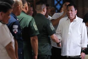 President Rodrigo Roa Duterte greets an officer of the Armed Forces of the Philippines during the Thanksgiving gathering he hosted for the AFP Council of the Sergeants Major at the Malacañan Palace on December 10, 2019. ALFRED FRIAS/PRESIDENTIAL PHOTO
