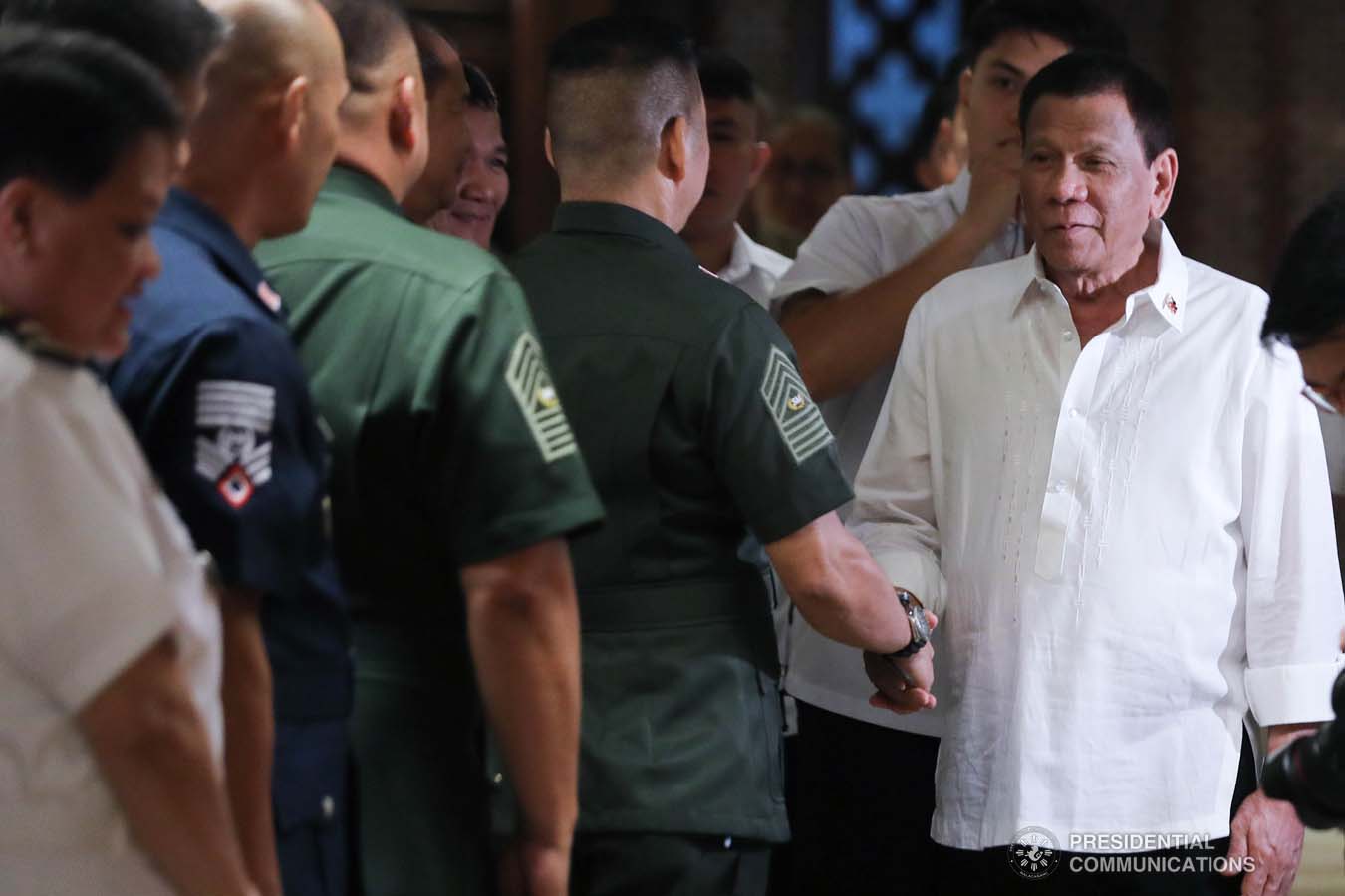 President Rodrigo Roa Duterte greets an officer of the Armed Forces of the Philippines during the Thanksgiving gathering he hosted for the AFP Council of the Sergeants Major at the Malacañan Palace on December 10, 2019. ALFRED FRIAS/PRESIDENTIAL PHOTO