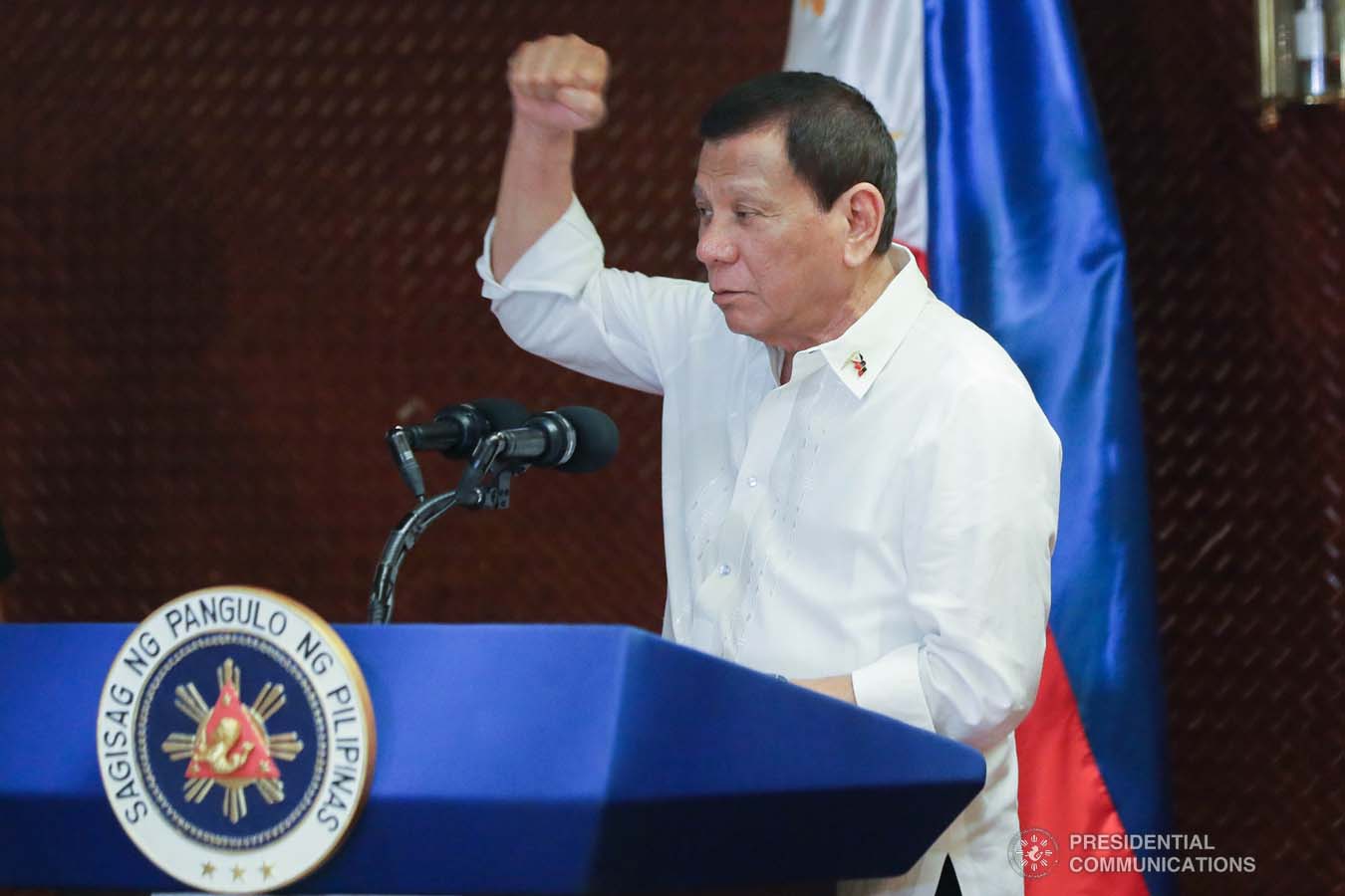 President Rodrigo Roa Duterte raises his fist while delivering his speech during the Thanksgiving gathering he hosted for the Armed Forces of the Philippines Council of the Sergeants Major at the Malacañan Palace on December 10, 2019. ALFRED FRIAS/PRESIDENTIAL PHOTO