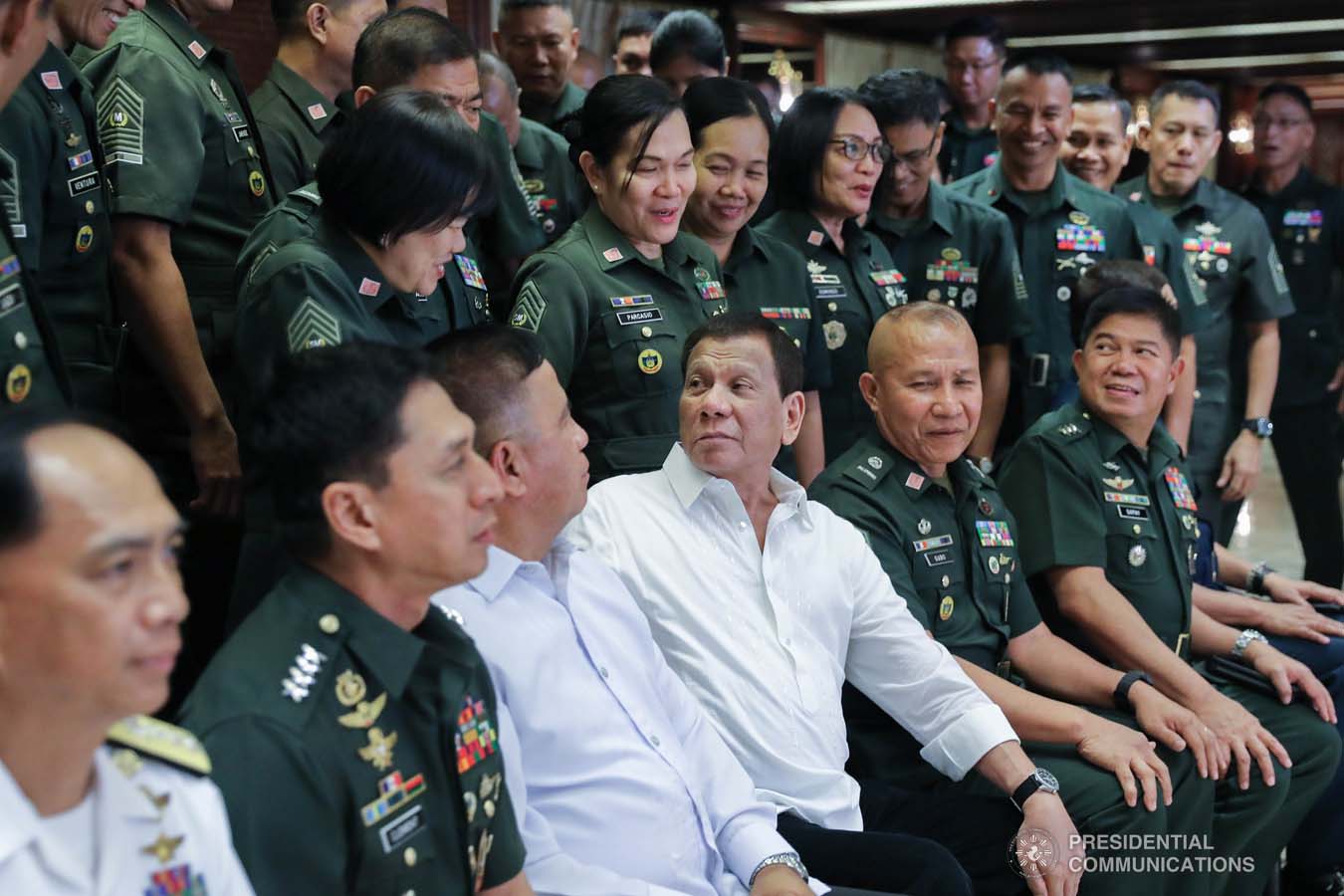 President Rodrigo Roa Duterte chats with an officer of the Armed Forces of the Philippines during the Thanksgiving gathering he hosted for the AFP Council of Sergeants Major at the Malacañan Palace on December 10, 2019. ALFRED FRIAS/PRESIDENTIAL PHOTO
