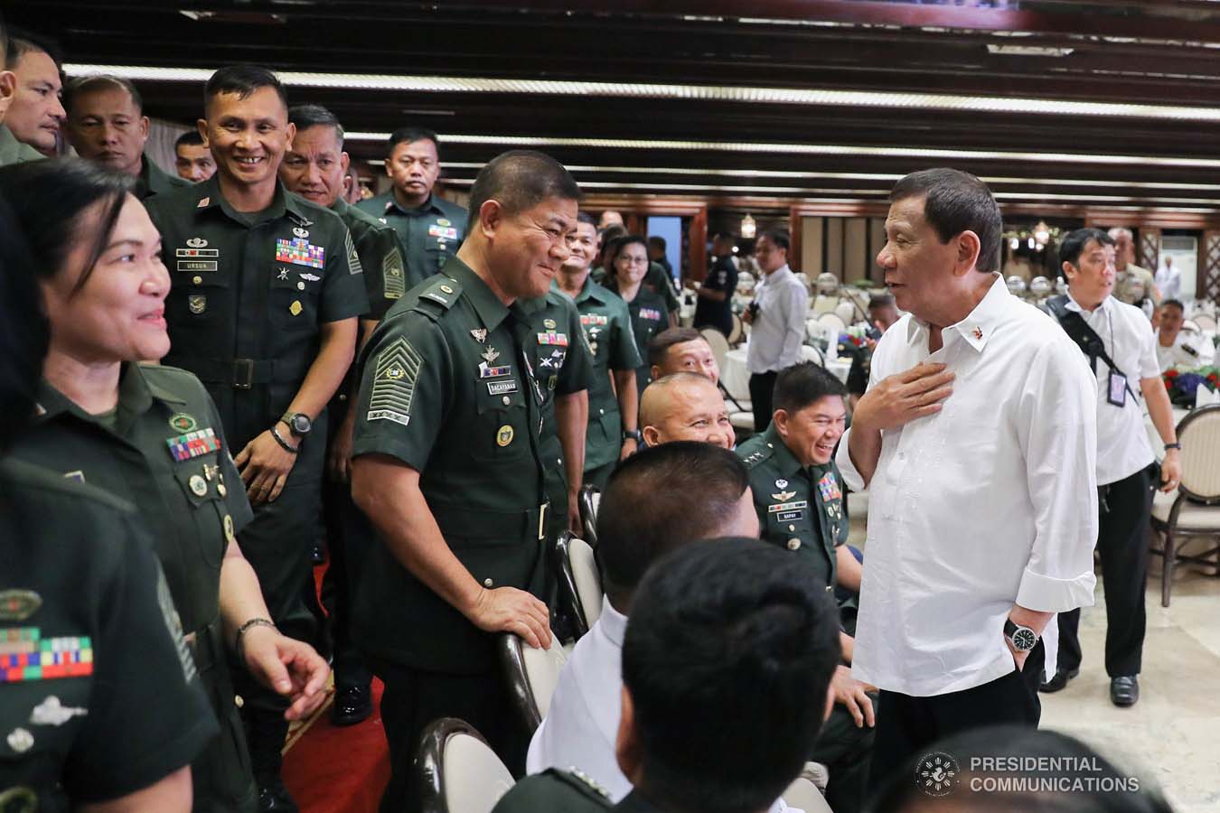 President Rodrigo Roa Duterte chats with an officer of the Armed Forces of the Philippines Council of the Sergeants Major during the Thanksgiving gathering he hosted at the Malacañan Palace on December 10, 2019. ALFRED FRIAS/PRESIDENTIAL PHOTO