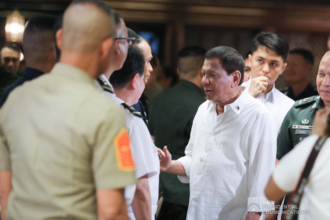 President Rodrigo Roa Duterte greets an officer of the Armed Forces of the Philippines during the Thanksgiving gathering he hosted for the AFP Council of the Sergeants Major at the Malacañan Palace on December 10, 2019. ALFRED FRIAS/PRESIDENTIAL PHOTO