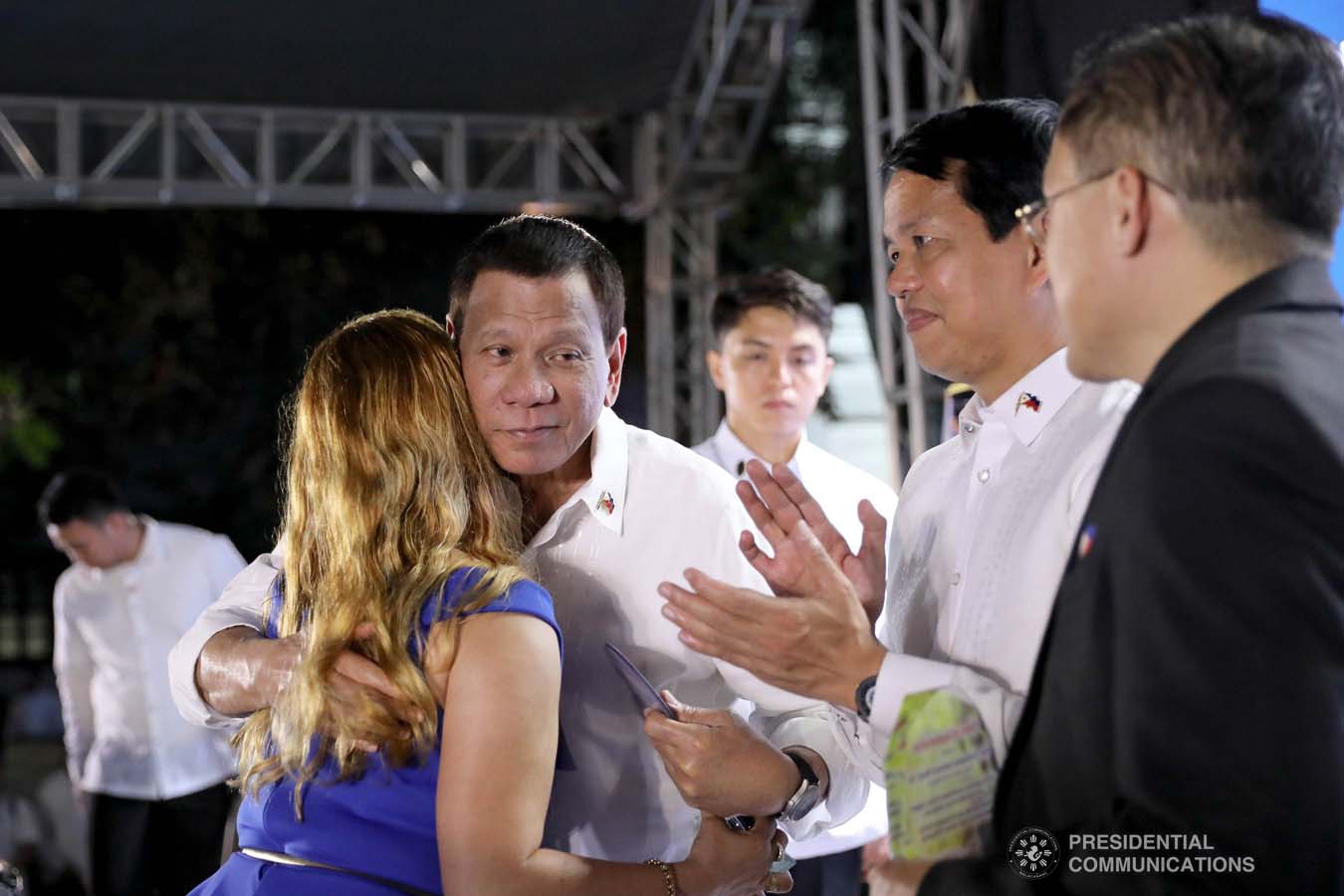 President Rodrigo Roa Duterte is greeted by one of the beneficiaries of the killed-in-action (KIA) soldiers and killed-in-police operation (KIPO) personnel under the Comprehensive Social Benefits Program during the Thanksgiving Party at the Malacañan Palace on December 10, 2019. ALFRED FRIAS/PRESIDENTIAL PHOTO
