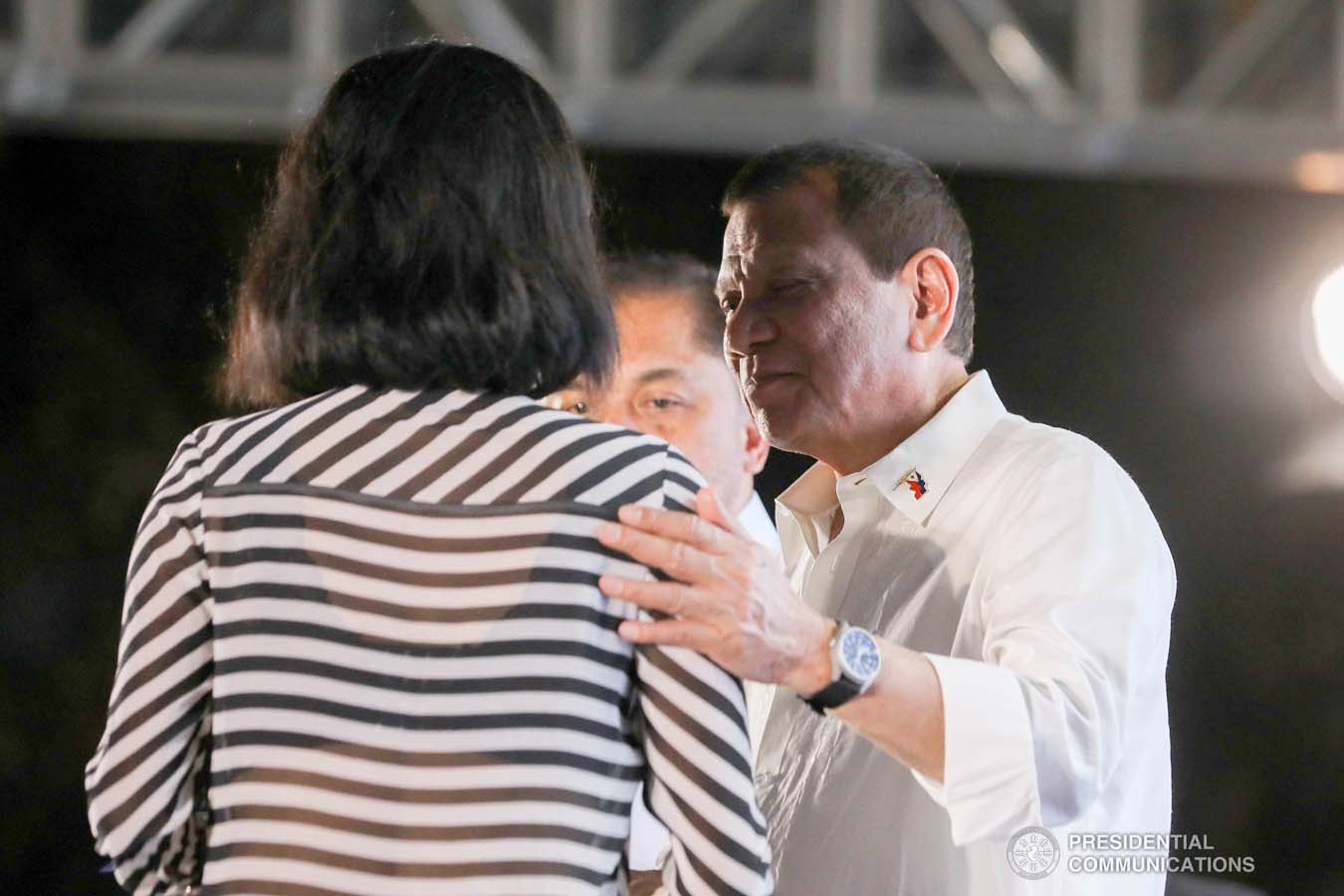President Rodrigo Roa Duterte leads the ceremonial turnover of housing certificates and checks to the beneficiaries of the killed-in-action (KIA) soldiers and killed-in-police operation (KIPO) personnel under the Comprehensive Social Benefits Program during the Thanksgiving party at the Malacañan Palace on December 10, 2019. ALFRED FRIAS/PRESIDENTIAL PHOTO