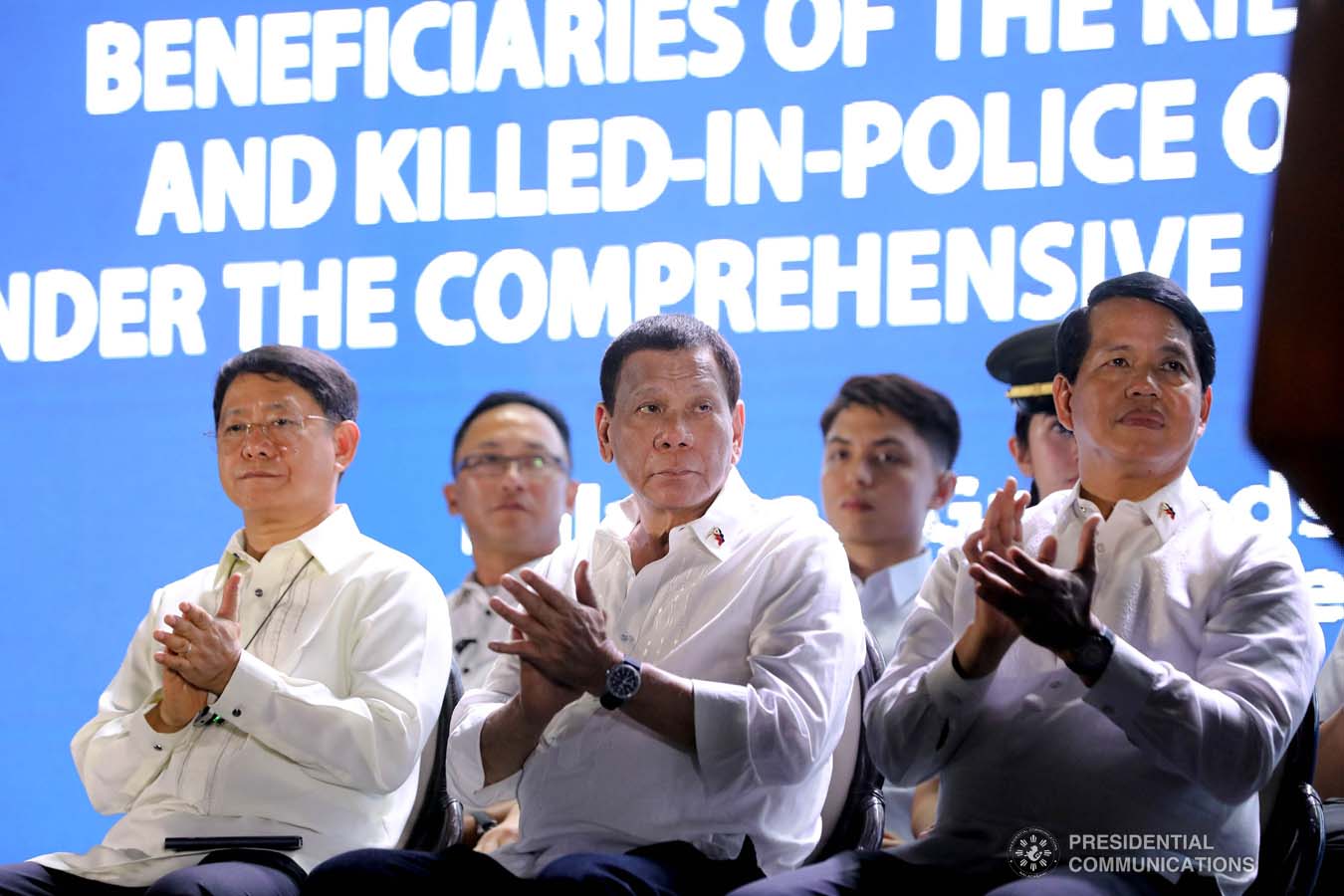 President Rodrigo Roa Duterte applauds while listening to the message of one of the beneficiaries of the killed-in-action (KIA) soldiers and killed-in-police operation (KIPO) personnel under the Comprehensive Social Benefits Program during the Thanksgiving party at the Malacañan Palace on December 10, 2019. ALFRED FRIAS/PRESIDENTIAL PHOTO