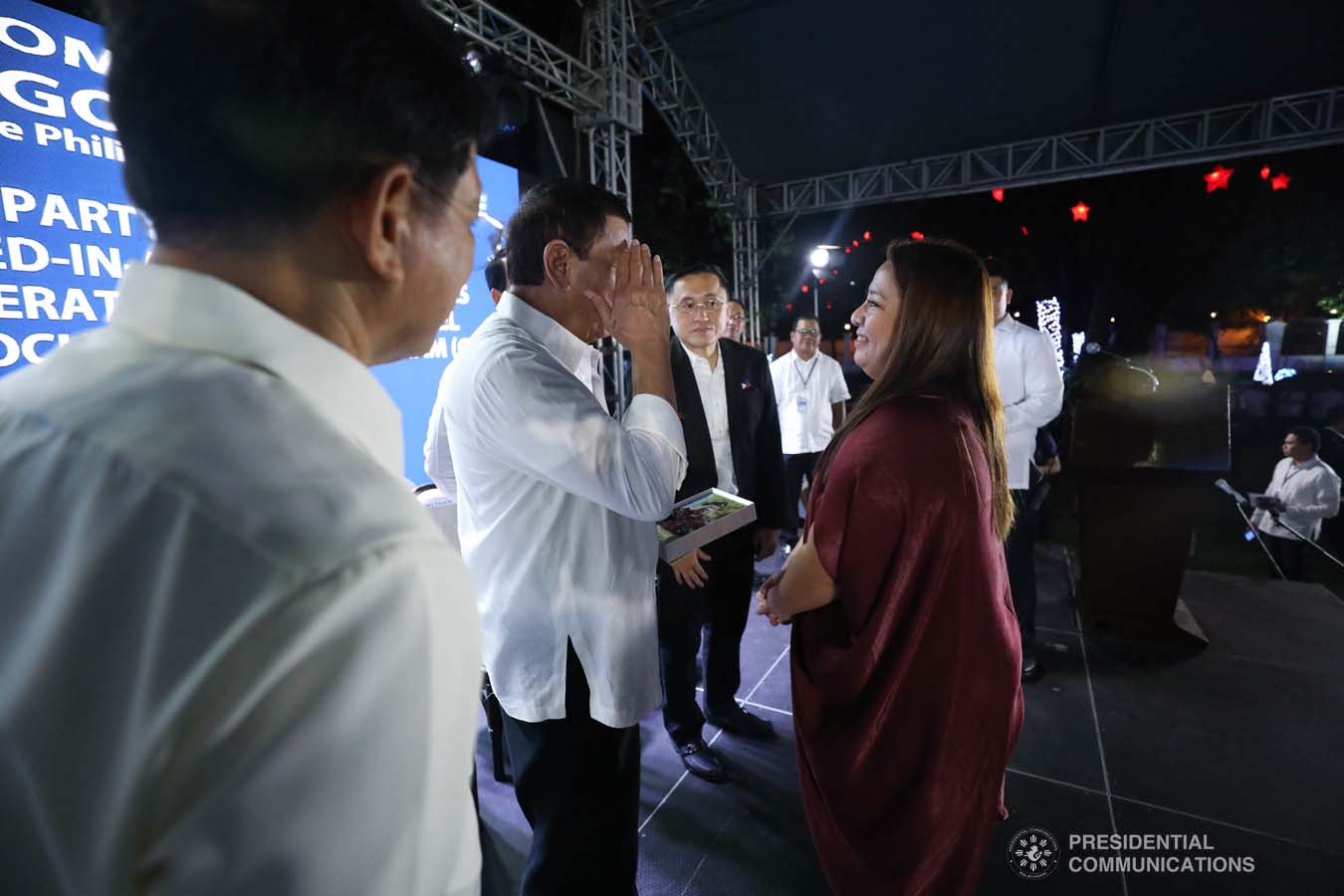 President Rodrigo Roa Duterte salutes one of the beneficiaries of the killed-in-action (KIA) soldiers and killed-in-police operation (KIPO) personnel under the Comprehensive Social Benefits Program during the Thanksgiving party at the Malacañan Palace on December 10, 2019. SIMEON CELI JR./PRESIDENTIAL PHOTO
