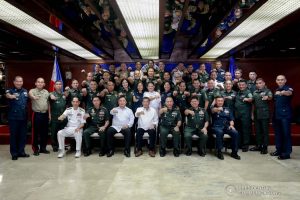 President Rodrigo Roa Duterte flashes his signature pose with officers of the Armed Forces of the Philippines Council of the Sergeants Major during the Thanksgiving gathering he hosted at the Malacañan Palace on December 10, 2019. SIMEON CELI JR./PRESIDENTIAL PHOTO