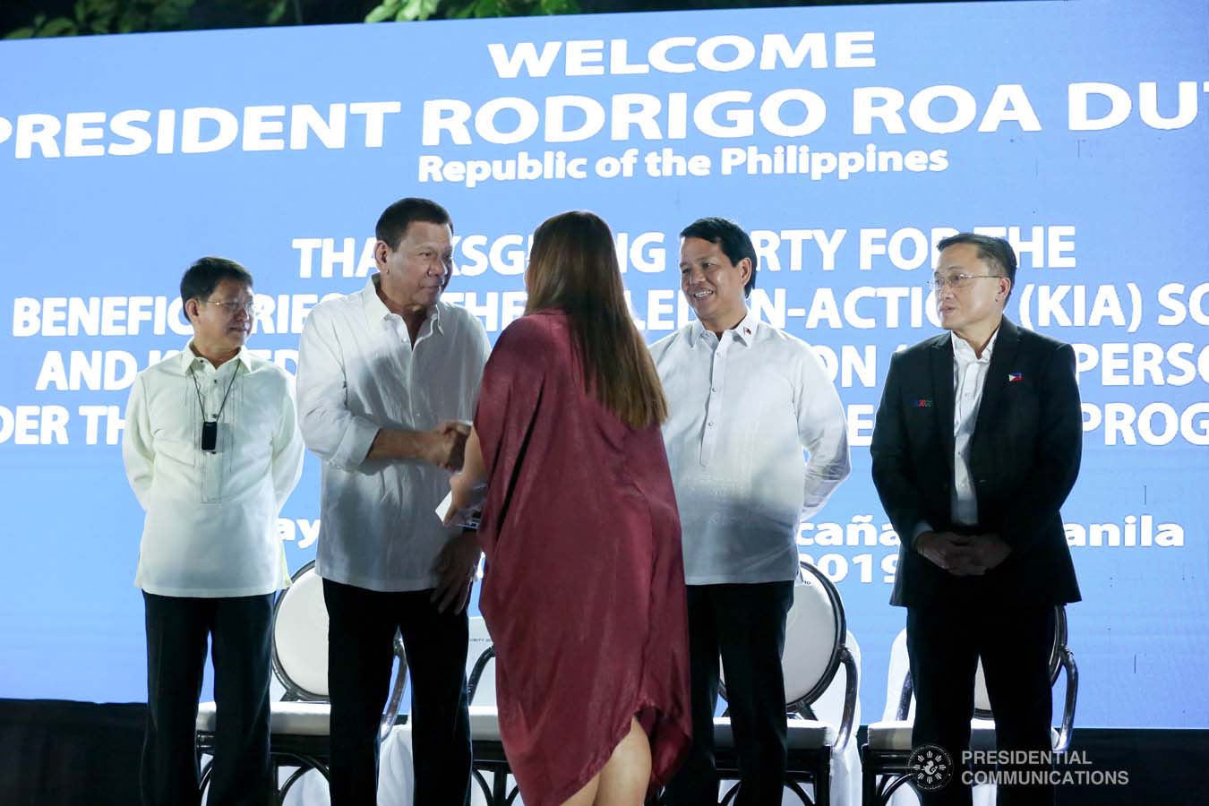 President Rodrigo Roa Duterte is greeted by one of the beneficiaries of the killed-in-action (KIA) soldiers and killed-in-police operation (KIPO) personnel under the Comprehensive Social Benefits Program during the Thanksgiving party at the Malacañan Palace on December 10, 2019. RICHARD MADELO/PRESIDENTIAL PHOTO