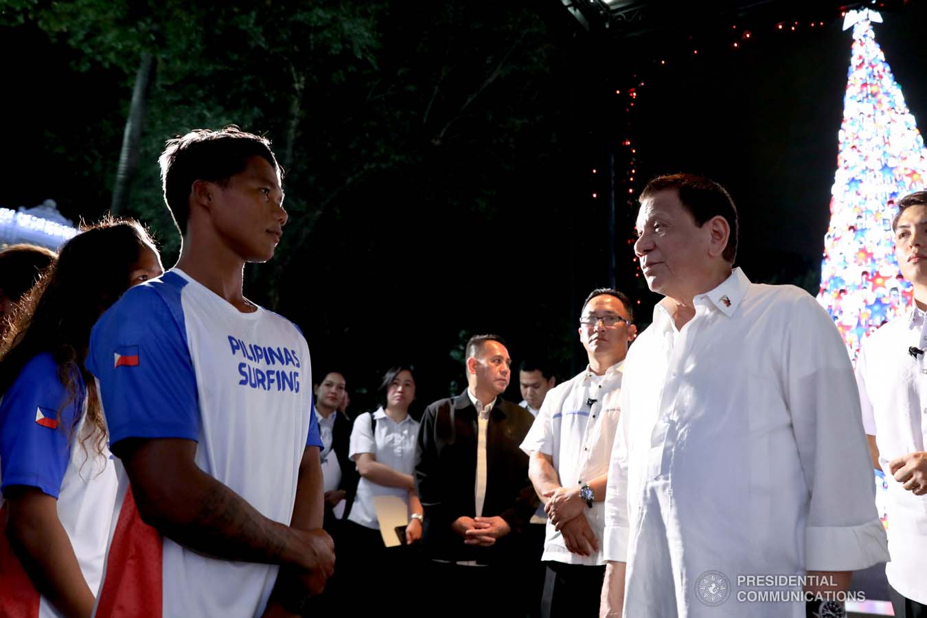 President Rodrigo Roa Duterte chats with Southeast Asian Games gold medalist Roger Casugay during a meeting with the Philippine Surfing Team at the Malacañan Palace on December 10, 2019. RICHARD MADELO/PRESIDENTIAL PHOTO