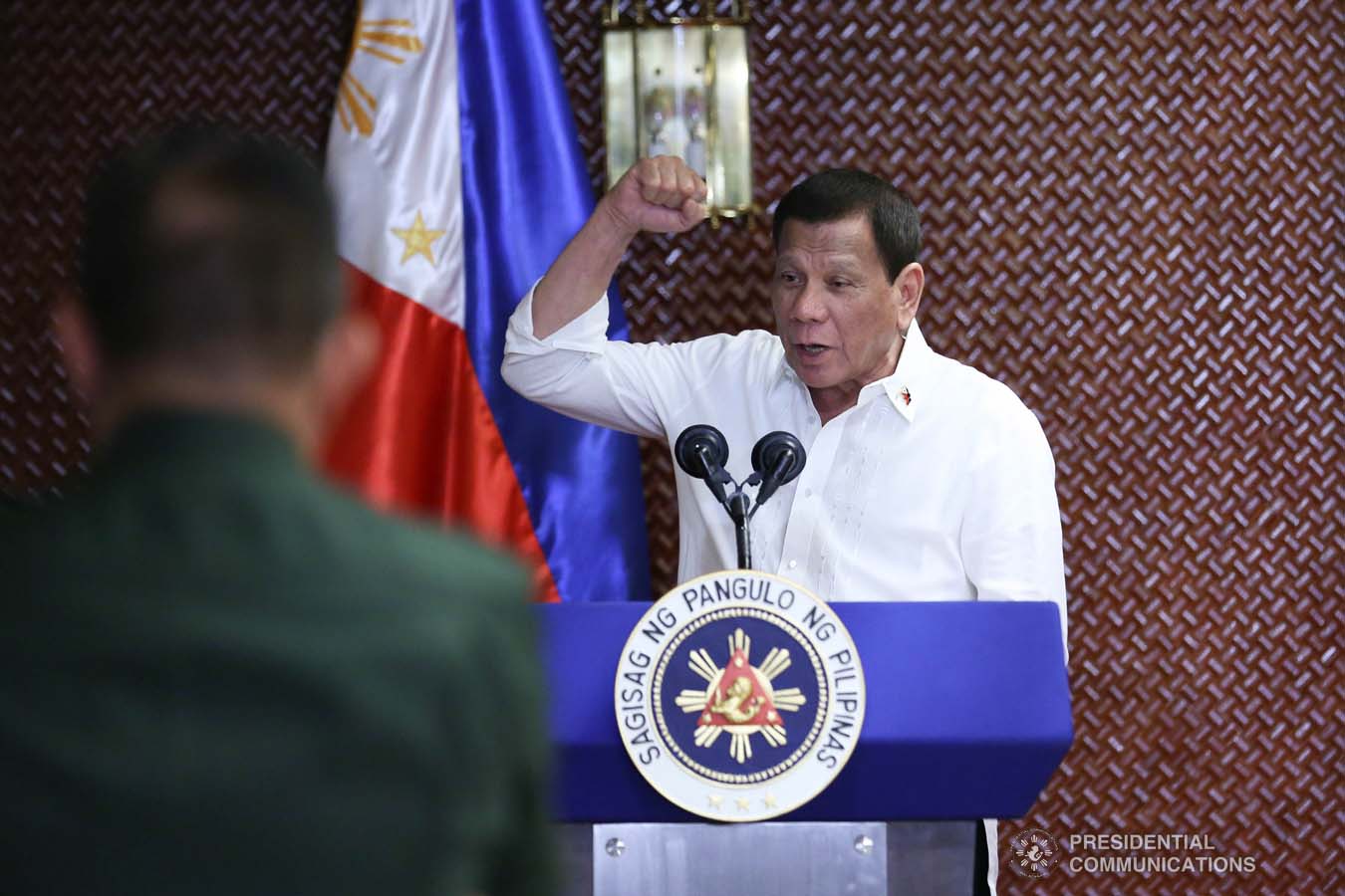 President Rodrigo Roa Duterte raises his fist while delivering a speech during the Thanksgiving gathering he hosted for the Armed Forces of the Philippines Council of the Sergeants Major at the Malacañan Palace on December 10, 2019. RICHARD MADELO/PRESIDENTIAL PHOTO