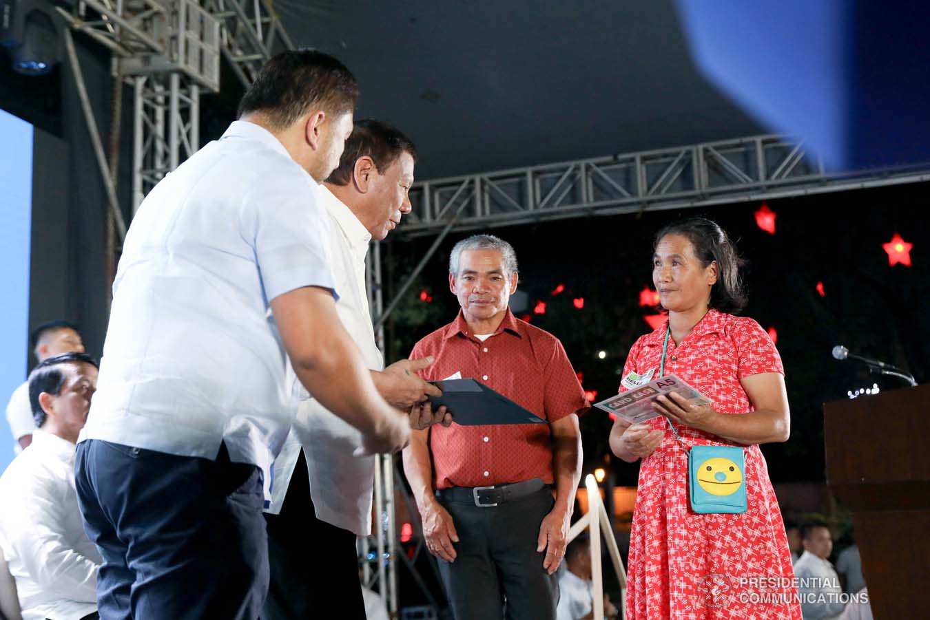 President Rodrigo Roa Duterte leads the ceremonial turnover of housing certificates and checks to the beneficiaries of the killed-in-action (KIA) soldiers and killed-in-police operation (KIPO) personnel under the Comprehensive Social Benefits Program during the Thanksgiving party at the Malacañan Palace on December 10, 2019. Assisting the President is National Housing Authority General Manager Marcelino Escalada Jr. RICHARD MADELO/PRESIDENTIAL PHOTO