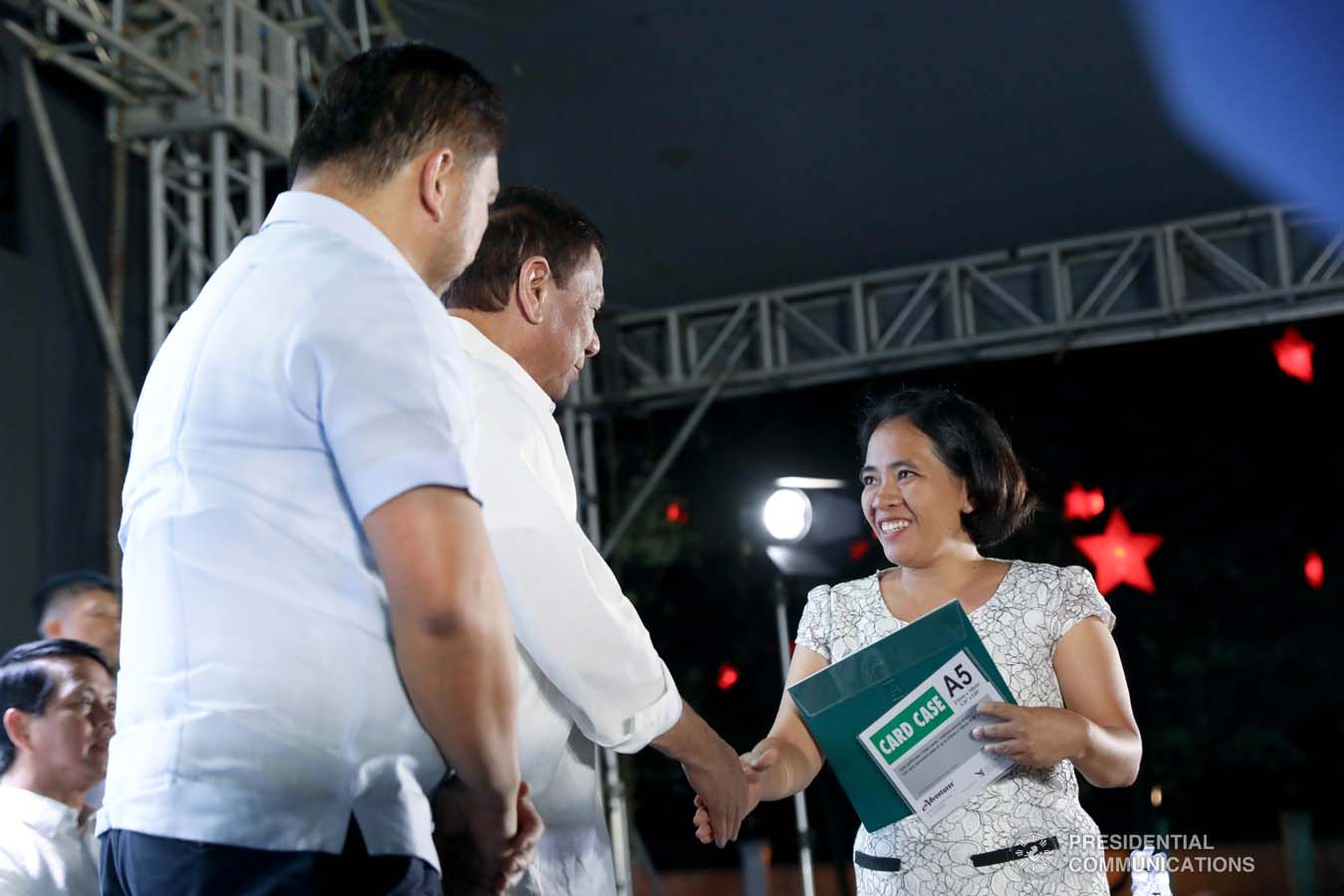 President Rodrigo Roa Duterte leads the ceremonial turnover of housing certificates and checks to the beneficiaries of the killed-in-action (KIA) soldiers and killed-in-police operation (KIPO) personnel under the Comprehensive Social Benefits Program during the Thanksgiving party at the Malacañan Palace on December 10, 2019. Assisting the President is National Housing Authority General Manager Marcelino Escalada Jr. RICHARD MADELO/PRESIDENTIAL PHOTO