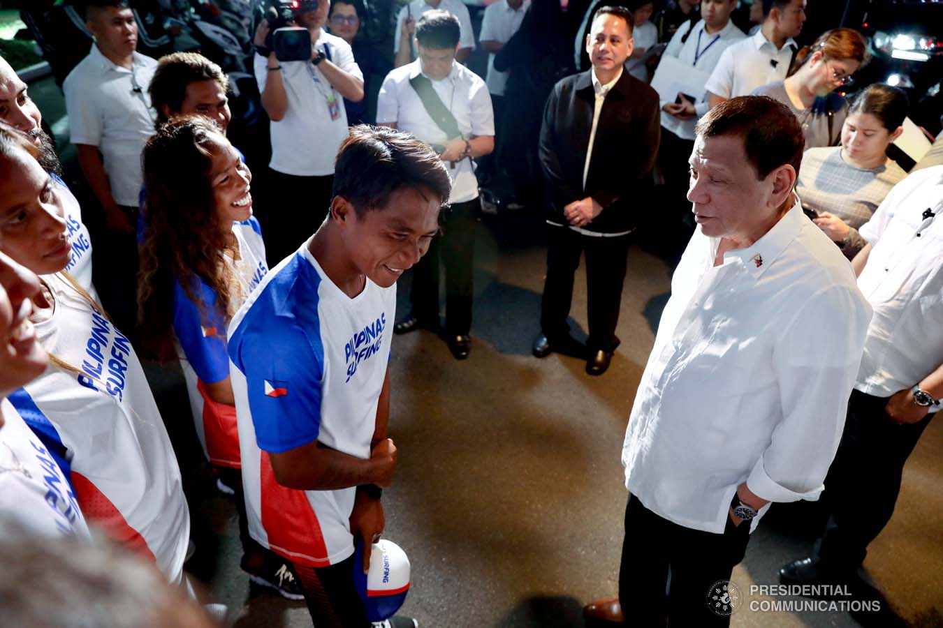 President Rodrigo Roa Duterte shares a light moment with Southeast Asian Games gold medalist Roger Casugay during a meeting with the Philippine Surfing Team at the Malacañan Palace on December 10, 2019. RICHARD MADELO/PRESIDENTIAL PHOTO