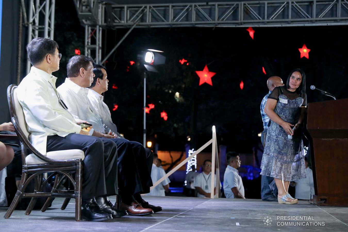 President Rodrigo Roa Duterte listens to the message of one of the beneficiaries of the killed-in-action (KIA) soldiers and killed-in-police operation (KIPO) personnel under the Comprehensive Social Benefits Program during the Thanksgiving party at the Malacañan Palace on December 10, 2019. RICHARD MADELO/PRESIDENTIAL PHOTO