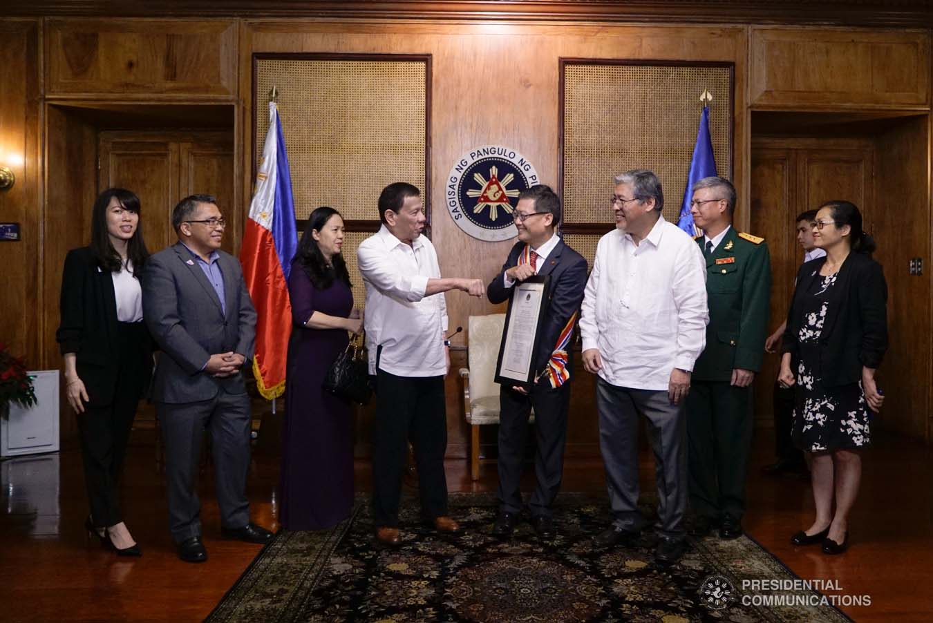 President Rodrigo Roa Duterte shows outgoing Ambassador of the Socialist Republic of Vietnam to the Philippines Ly Quoc Tuan how to do his signature pose during the outgoing Ambassador's farewell call to the President at the Malacañan Palace on December 11, 2019. KING RODRIGUEZ/PRESIDENTIAL PHOTO