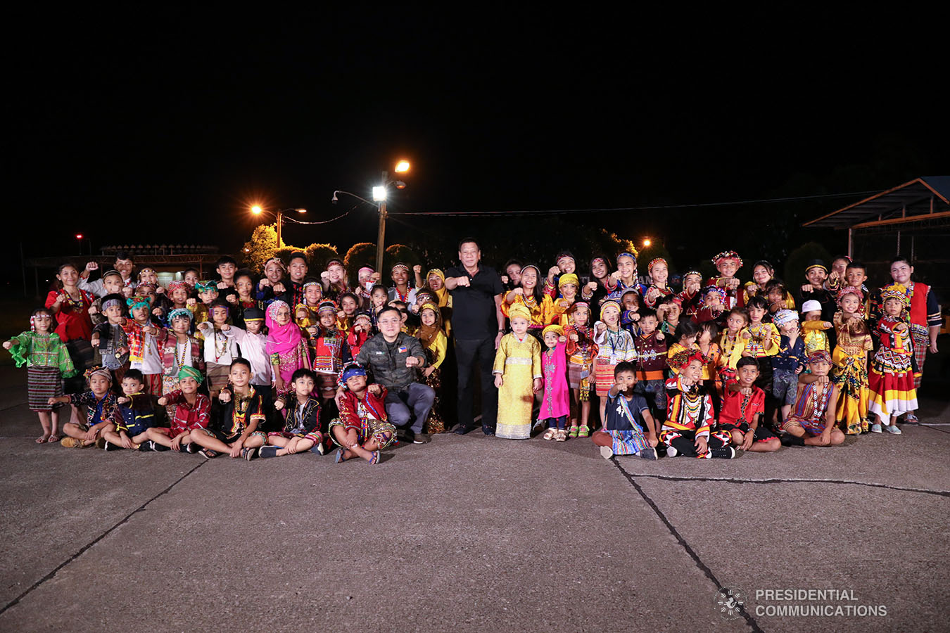 President Rodrigo Roa Duterte strikes his signature pose with the children from various Indigenous People tribes in Mindanao at the Tactical Operations Group (TOG)-11 in Davao City on December 14, 2019. ACE MORANDANTE/PRESIDENTIAL PHOTO