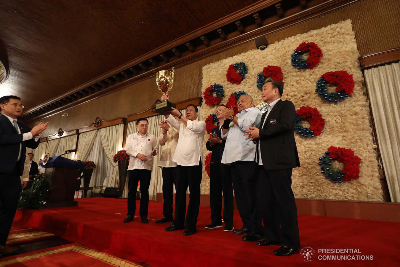 President Rodrigo Roa Duterte raises the overall champion trophy of the Philippine Team during the recognition of the 2019 Southeast Asian Games medalists at the Malacañan Palace on December 18, 2019. The Philippine Team emerged as overall champion in the recently-concluded 2019 SEA Games after garnering 149 golds, 117 silvers and 121 bronzes. KARL NORMAN ALONZO/PRESIDENTIAL PHOTO