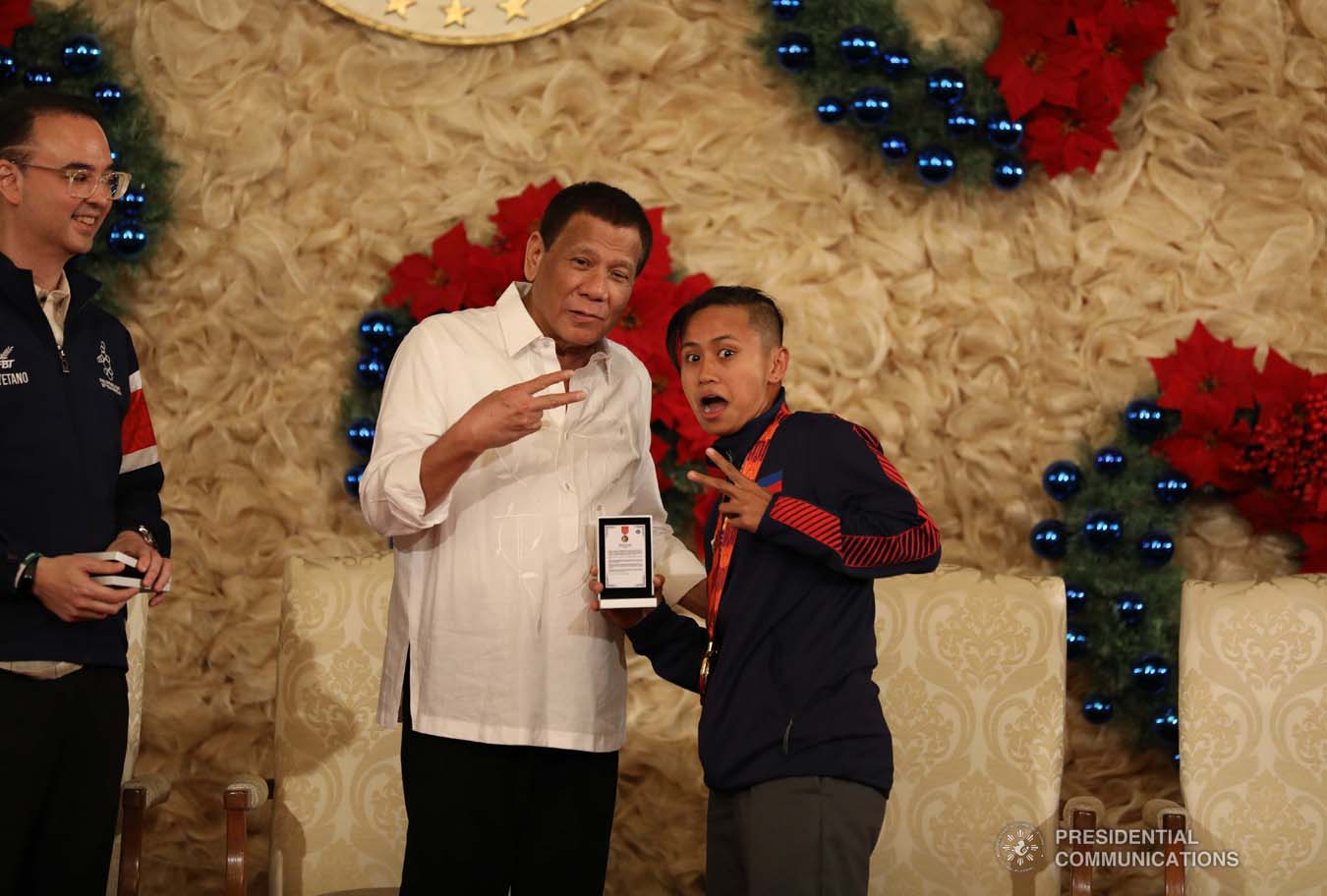 President Rodrigo Roa Duterte strikes a wacky pose with skateboarding gold medalist Margielyn Didal during the awarding of the Order of Lapu-Lapu Rank of Kamagi to the 2019 Southeast Asian Games medalists at the Malacañan Palace on December 18, 2019. KARL NORMAN ALONZO/PRESIDENTIAL PHOTO