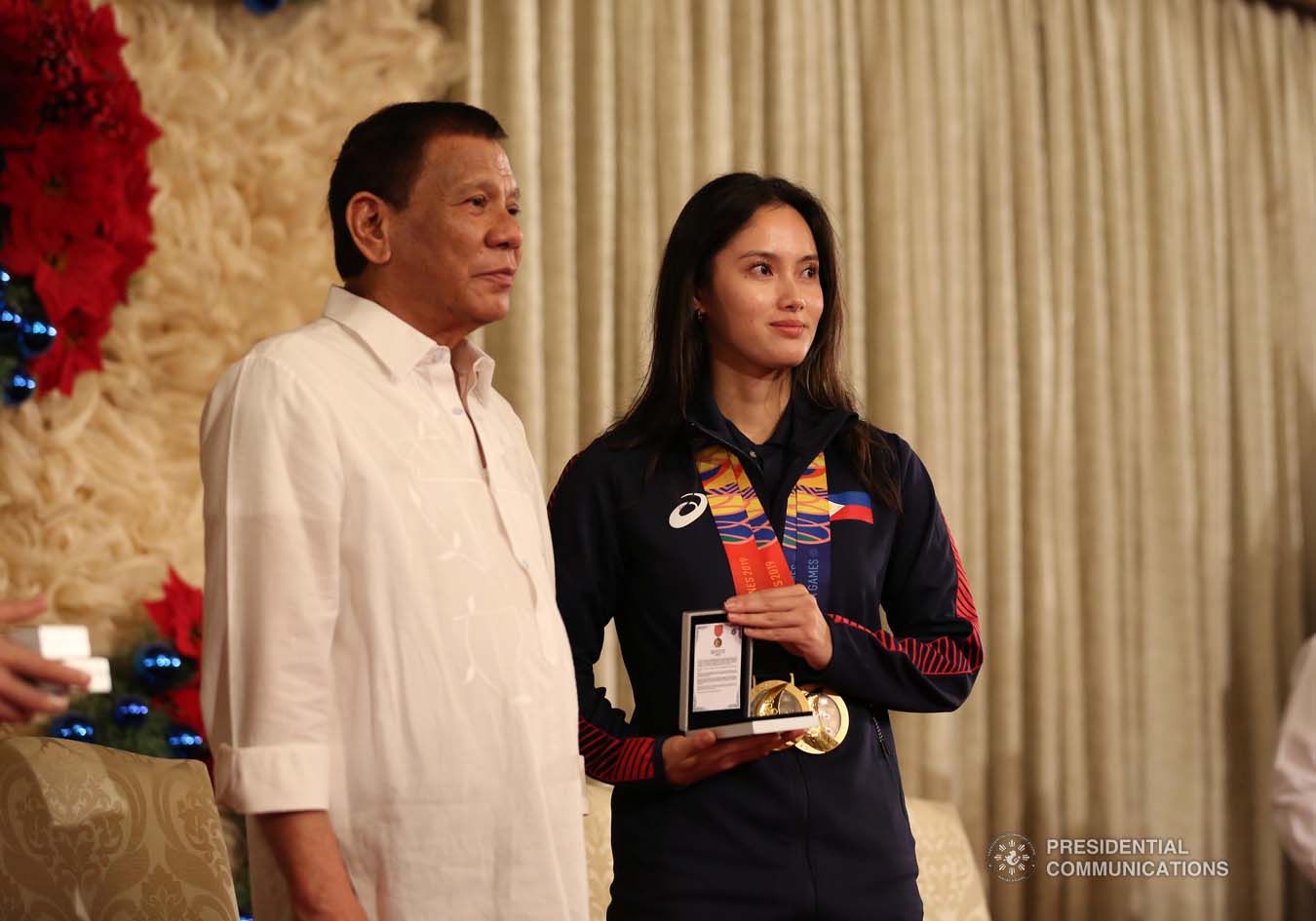 President Rodrigo Roa Duterte confers the Order of Lapu-Lapu Rank of Kamagi on 2019 Southeast Asian Games wushu gold medalist Agatha Wong during a ceremony at the Malacañan Palace on December 18, 2019. KARL NORMAN ALONZO/PRESIDENTIAL PHOTO