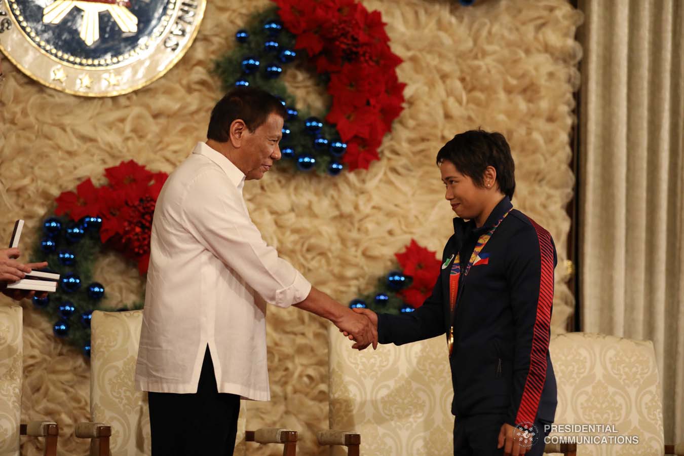 President Rodrigo Roa Duterte congratulates weightlifting gold medalist Hidilyn Diaz during the awarding of the Order of Lapu-Lapu Rank of Kamagi to the 2019 Southeast Asian Games medalists at the Malacañan Palace on December 18, 2019. KARL NORMAN ALONZO/PRESIDENTIAL PHOTO