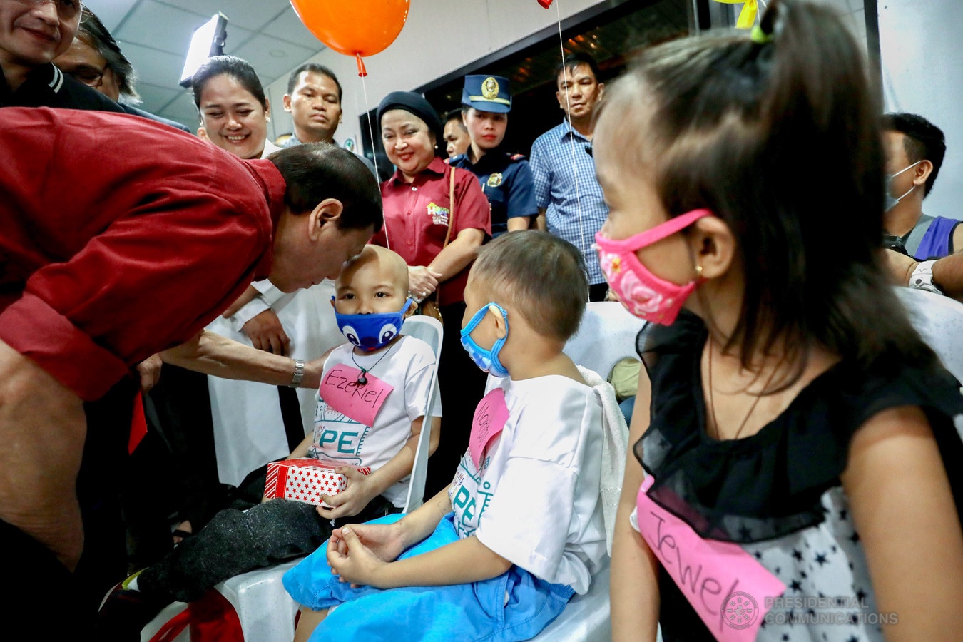 President Rodrigo Roa Duterte plants a kiss on the forehead of one of the pediatric cancer patients he visited at the Southern Philippines Medical Center-Children's Cancer Institute in Davao City on December 28, 2019. RICHARD MADELO/PRESIDENTIAL PHOTO