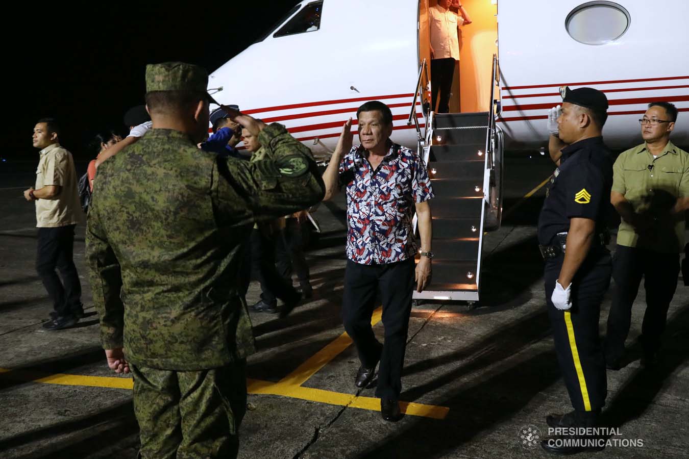 President Rodrigo Roa Duterte salutes a military officer upon his arrival at the Legazpi City Airport before heading to the Legazpi City Convention Center for the situation briefing on the effects of Typhoon Tisoy on December 5, 2019. ROBINSON NIÑAL JR./PRESIDENTIAL PHOTO